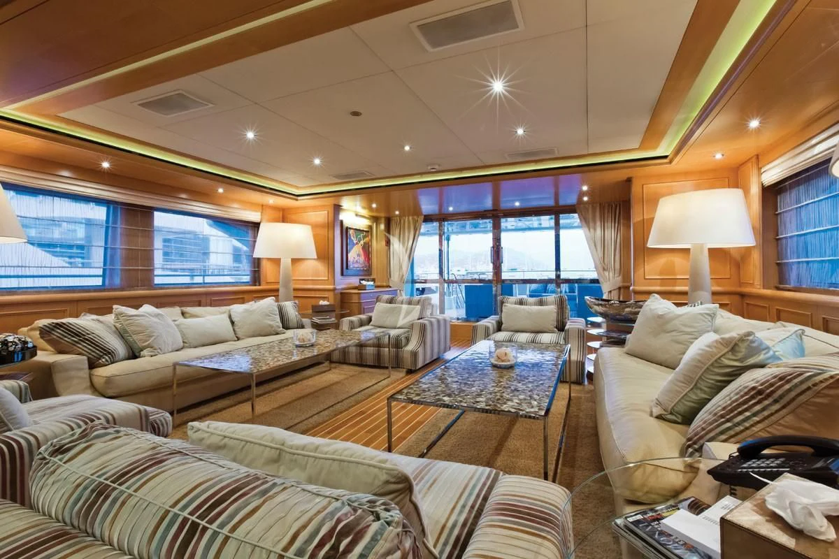 a living room with a large window aboard HANA Yacht for Charter