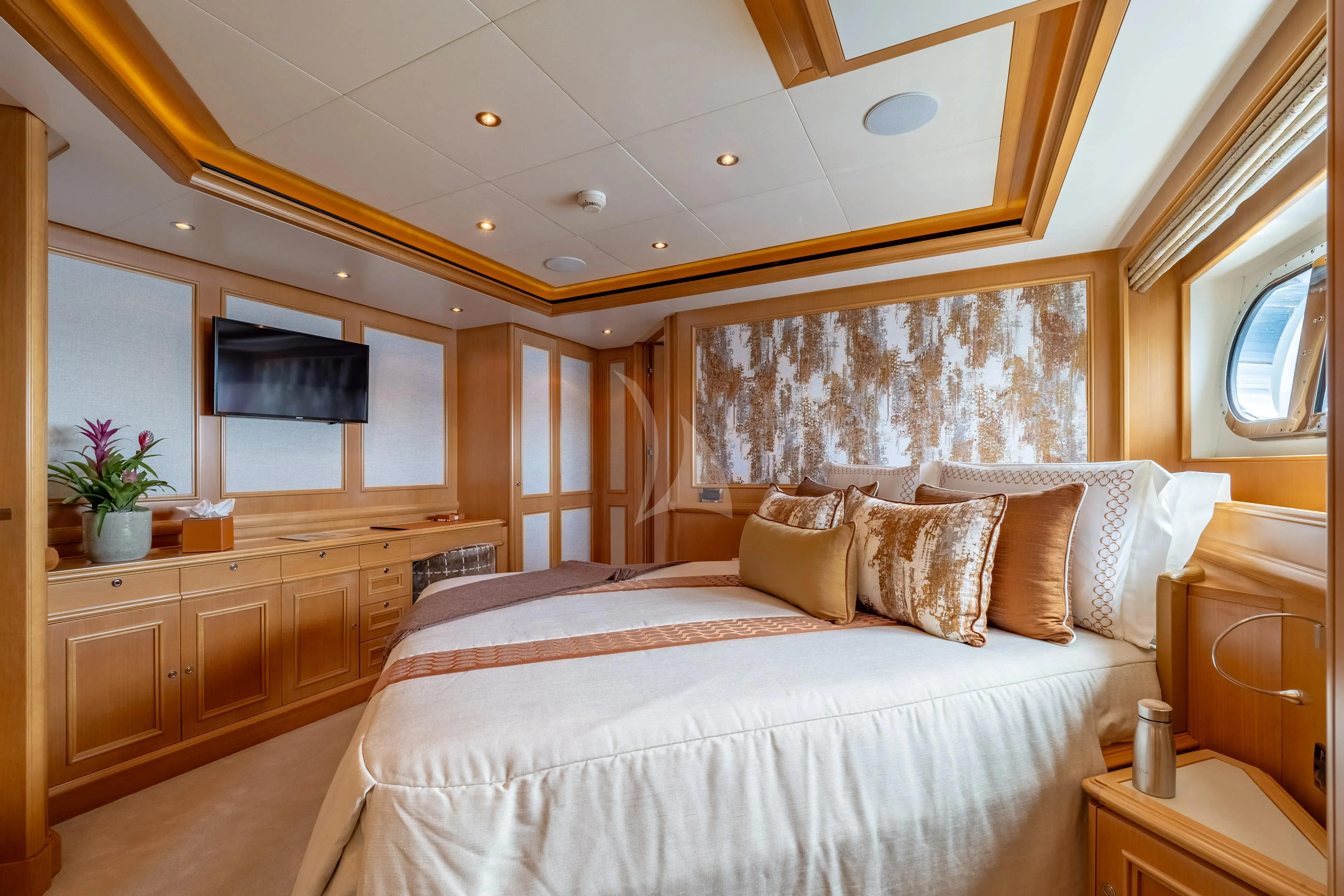 a large bedroom with a large bed aboard HANA Yacht for Charter