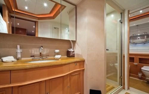 a bathroom with a sink and a mirror aboard HANA Yacht for Charter