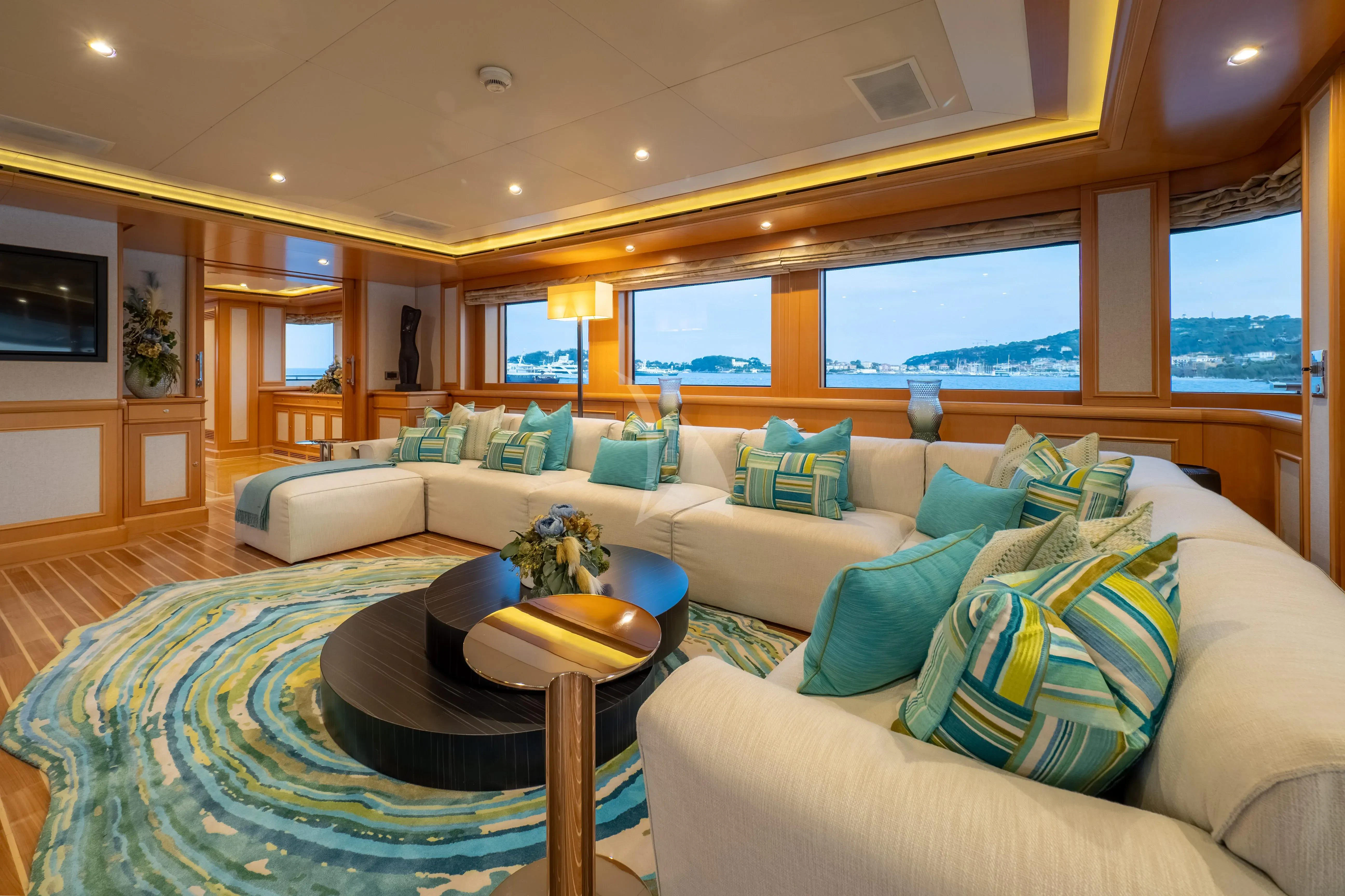 a living room with a large window aboard HANA Yacht for Charter