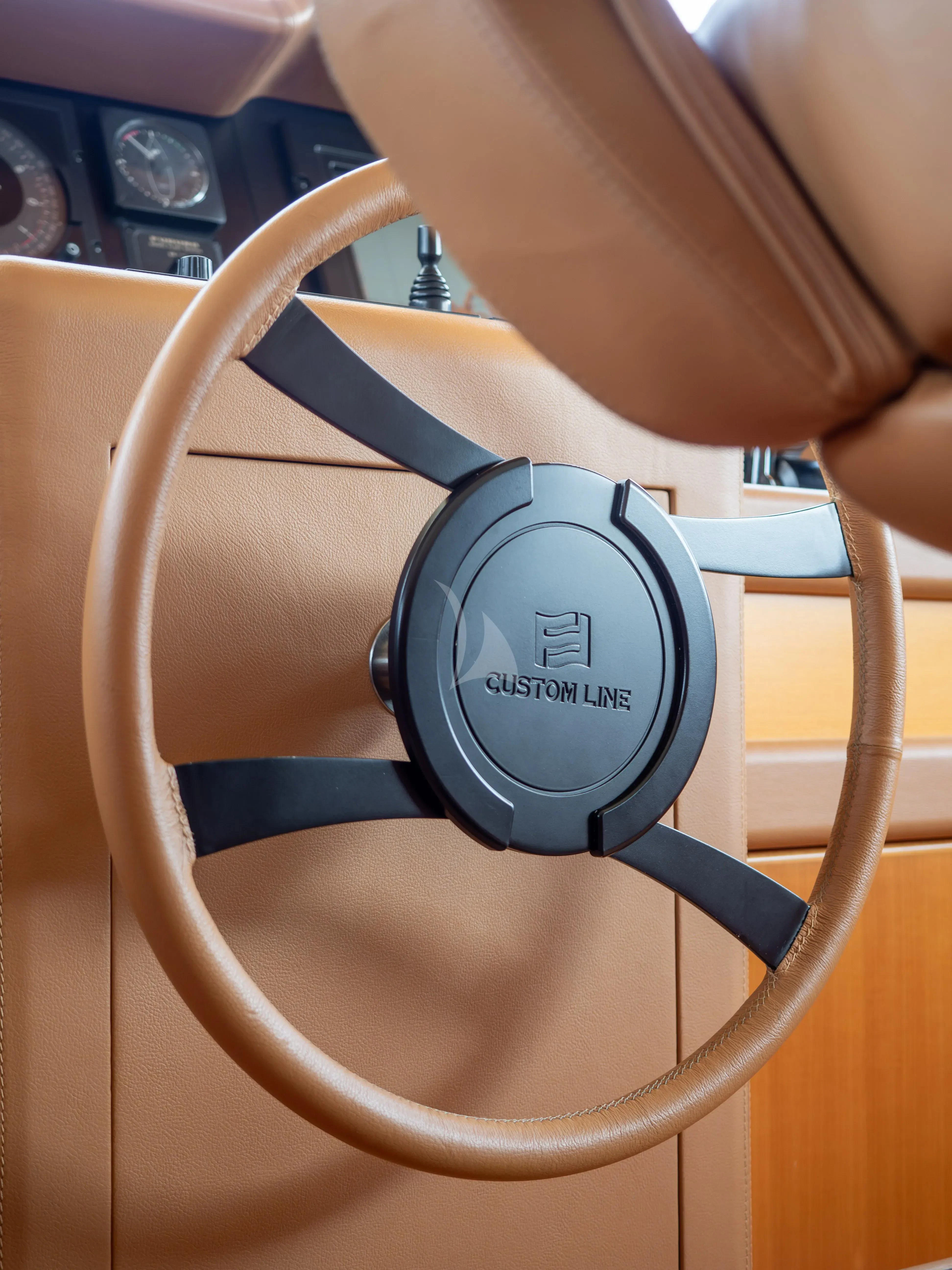 a person holding a power cord aboard HANA Yacht for Charter