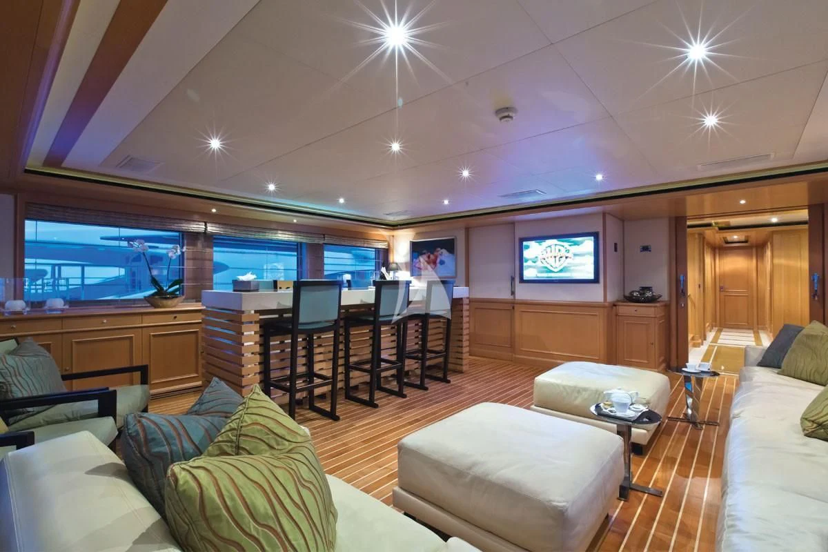a living room with a large window aboard HANA Yacht for Charter