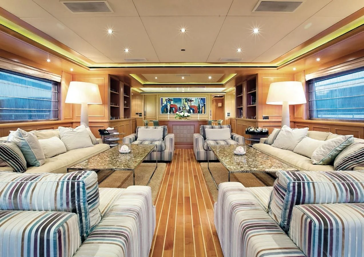 a living room with a couch and a table aboard HANA Yacht for Charter