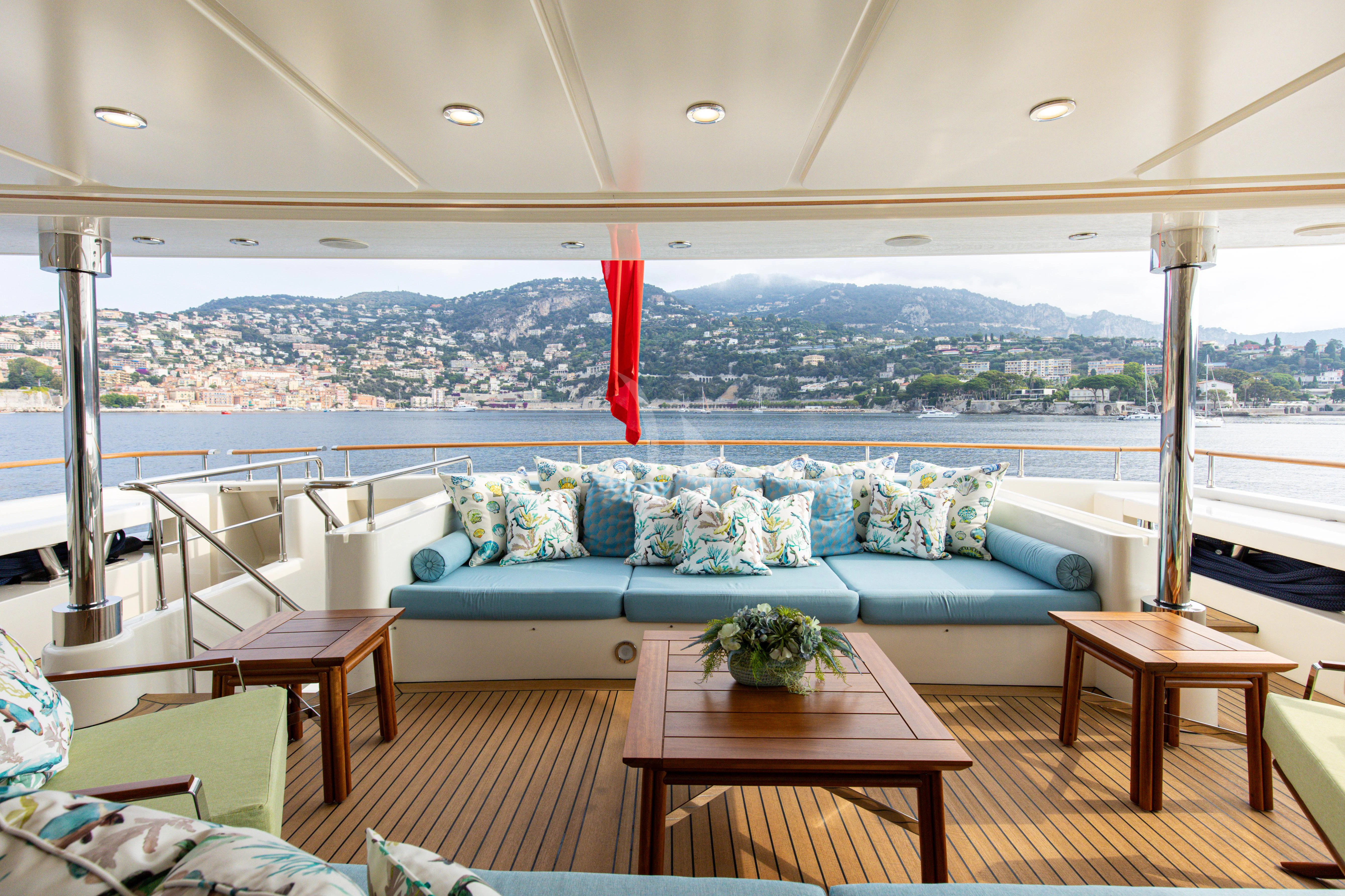 a living room with a large window aboard HANA Yacht for Charter