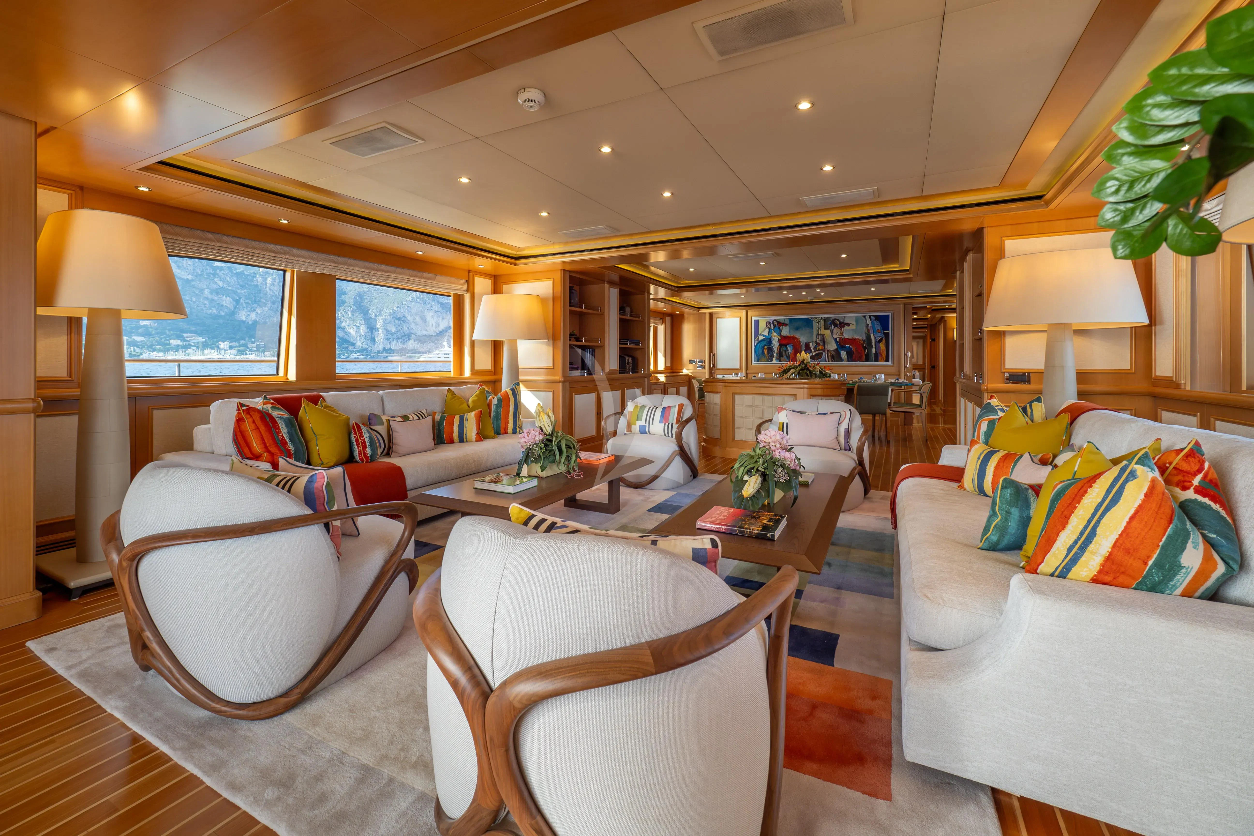 a living room with a large window aboard HANA Yacht for Charter