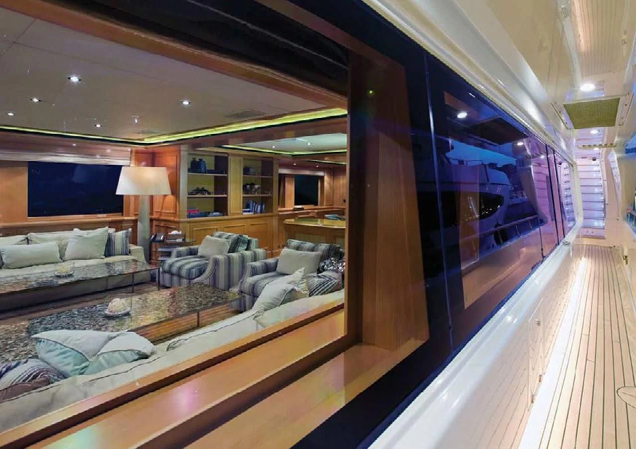 a living room with a large mirror aboard HANA Yacht for Charter