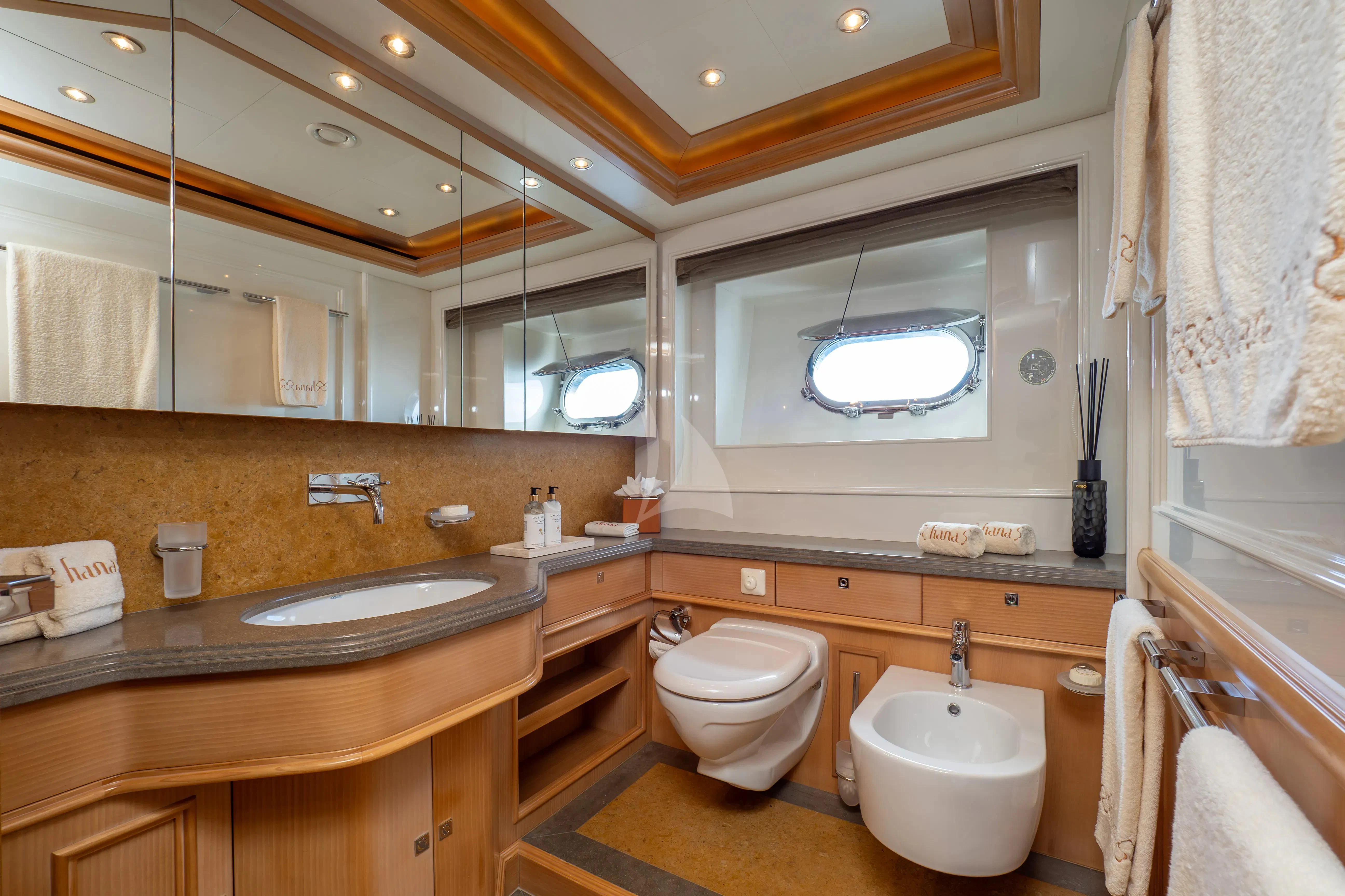 a bathroom with a sink and toilet aboard HANA Yacht for Charter