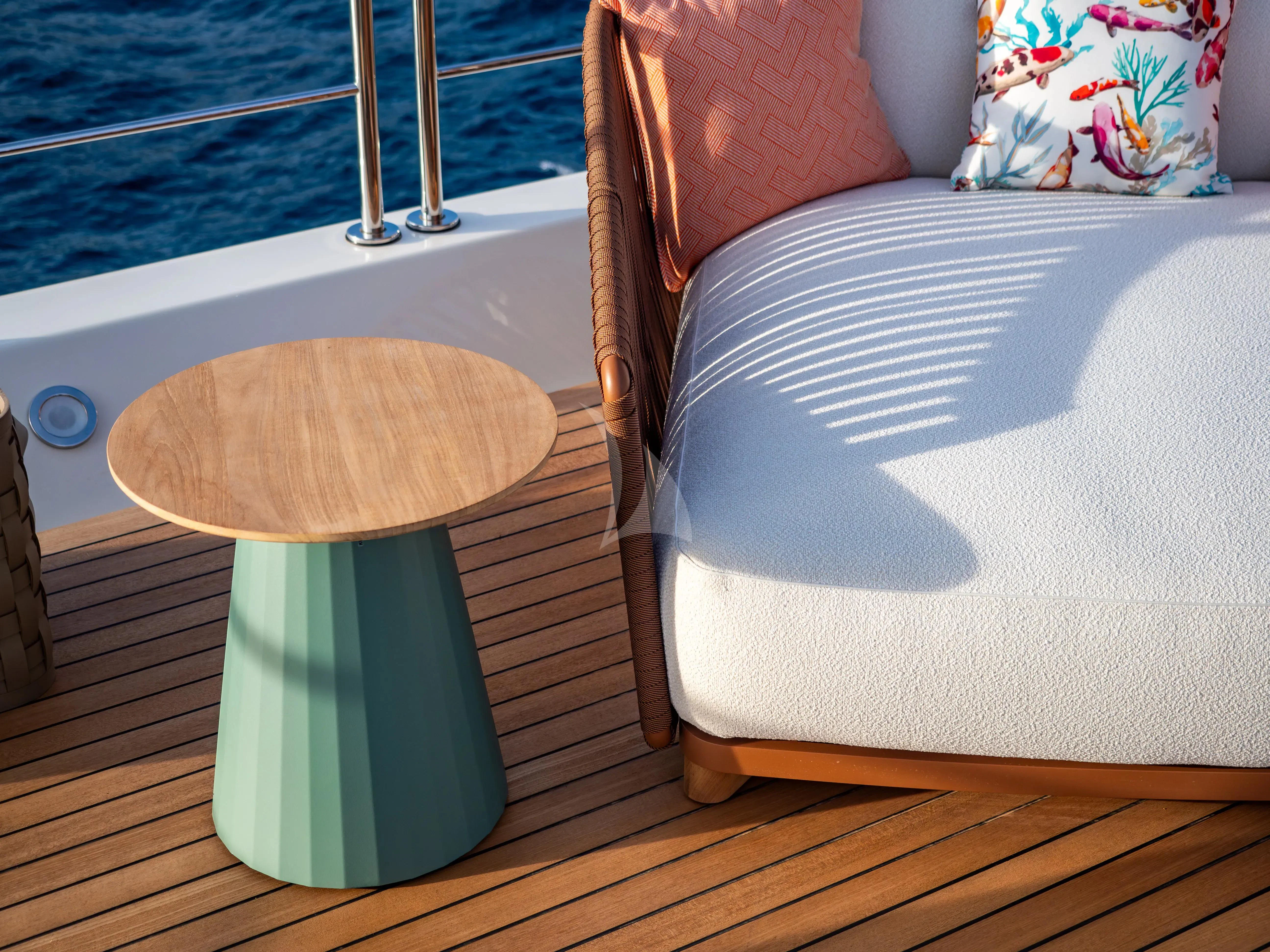 a stool on a porch aboard HANA Yacht for Charter