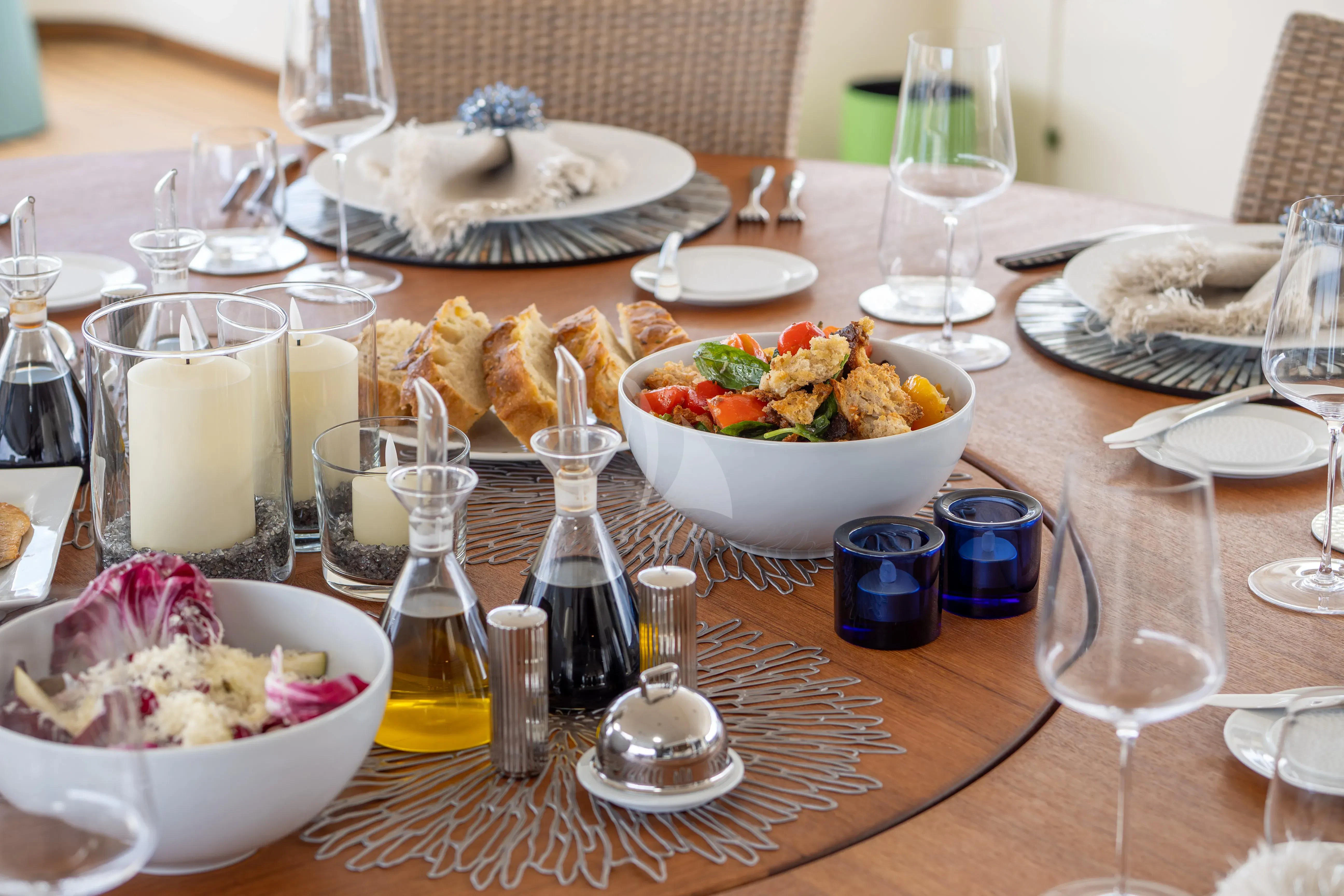 a table with food and drinks aboard HANA Yacht for Charter