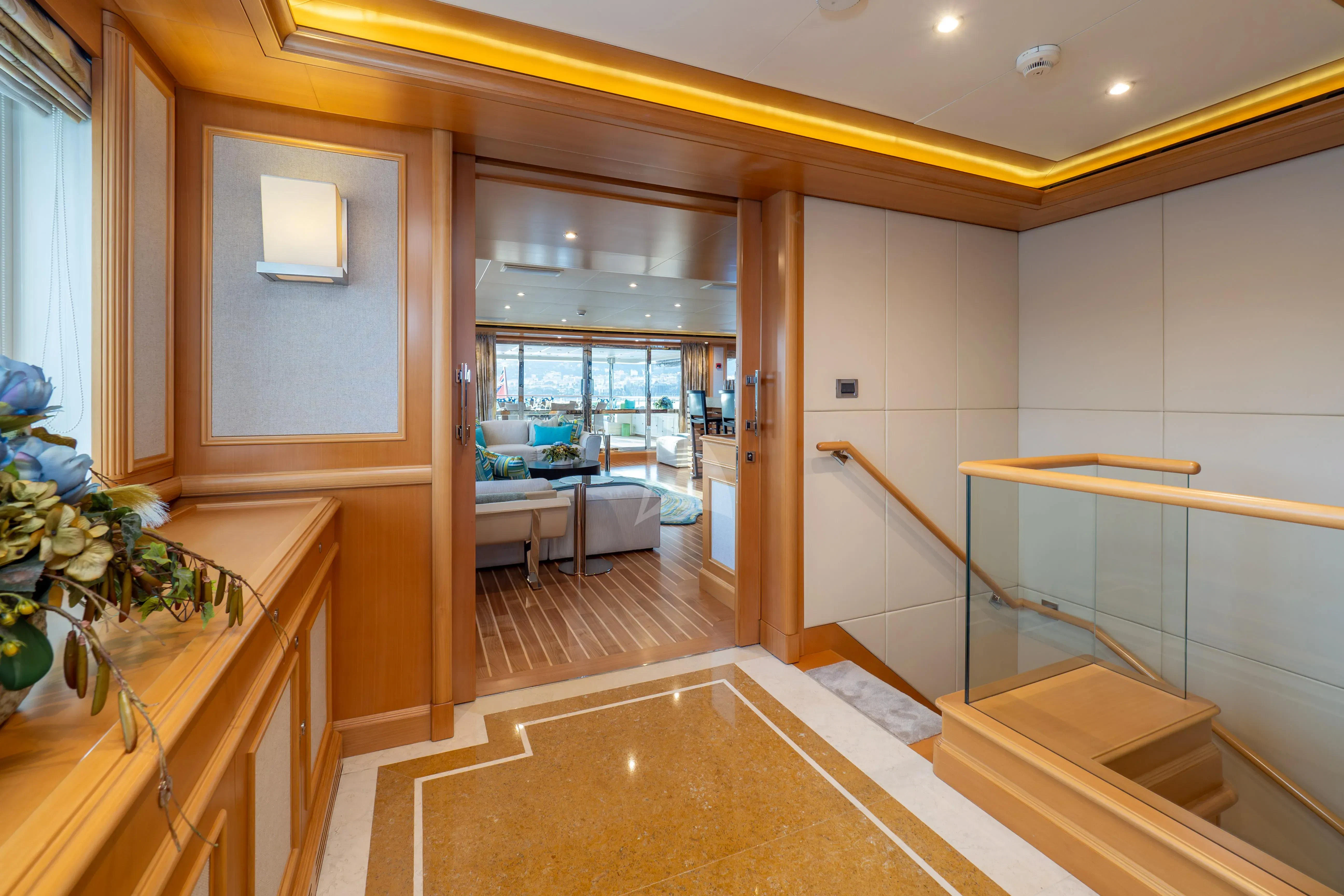 a room with a table and chairs aboard HANA Yacht for Charter