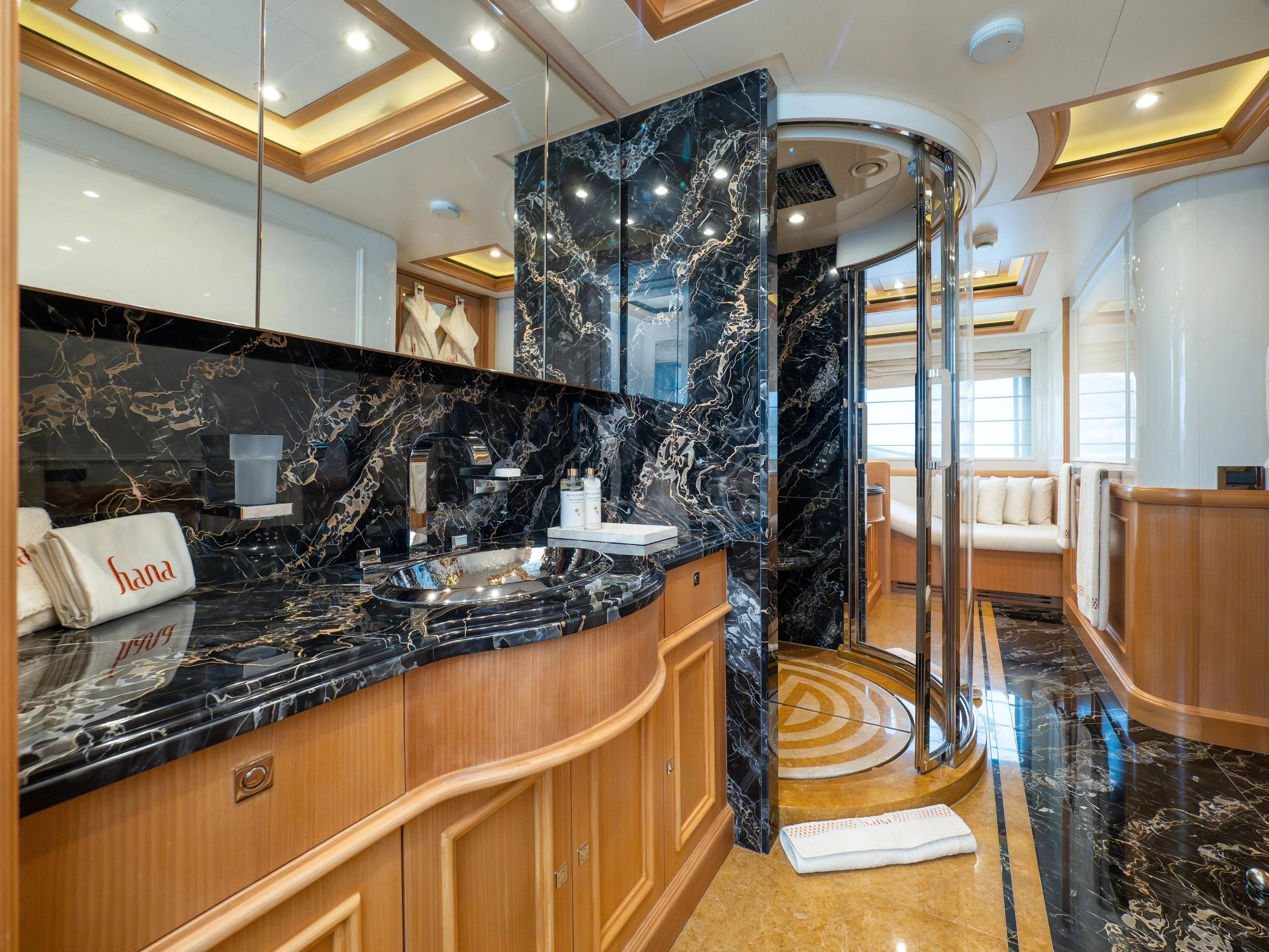 a bathroom with a sink and a shower aboard HANA Yacht for Charter