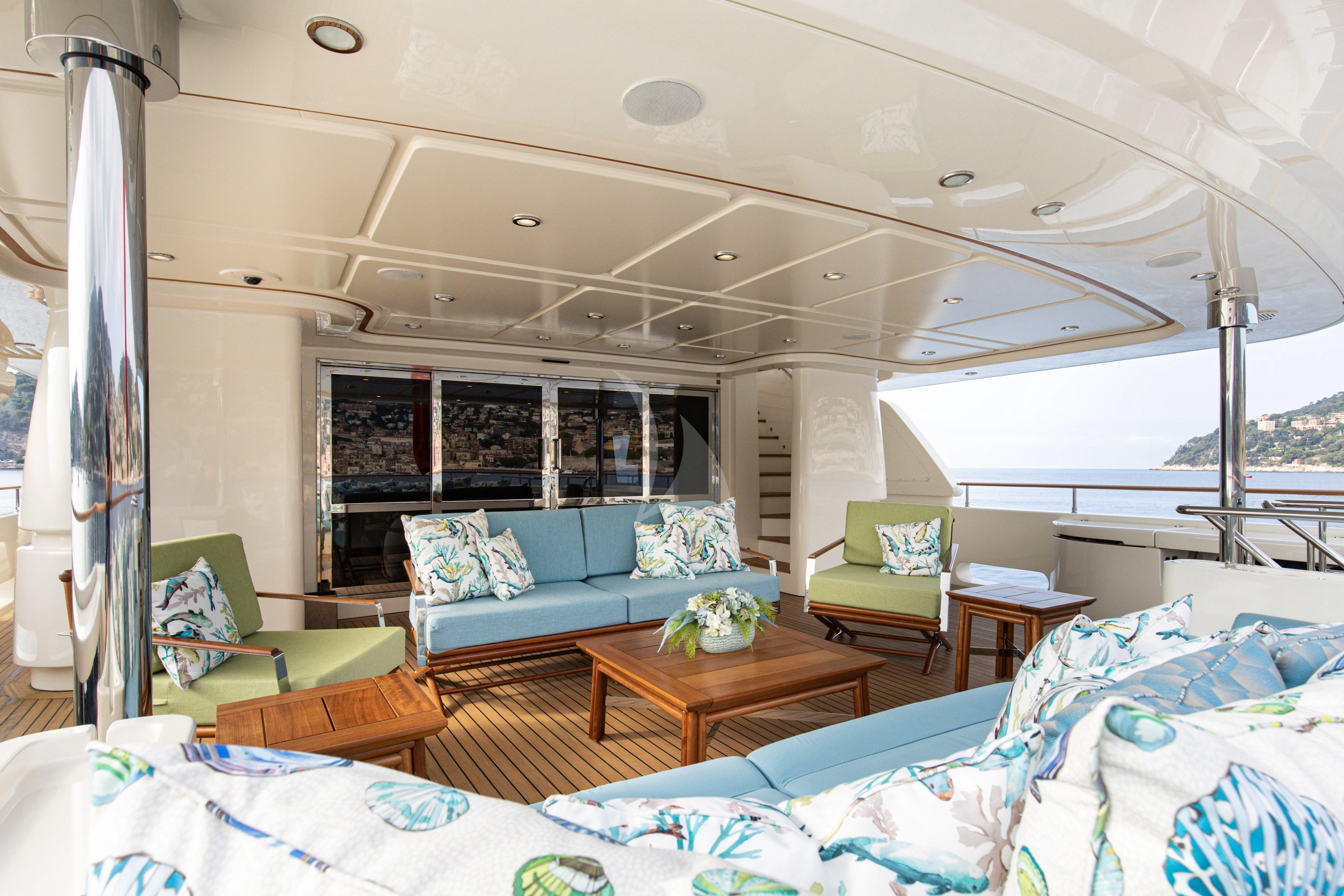 a living room with a large window aboard HANA Yacht for Charter
