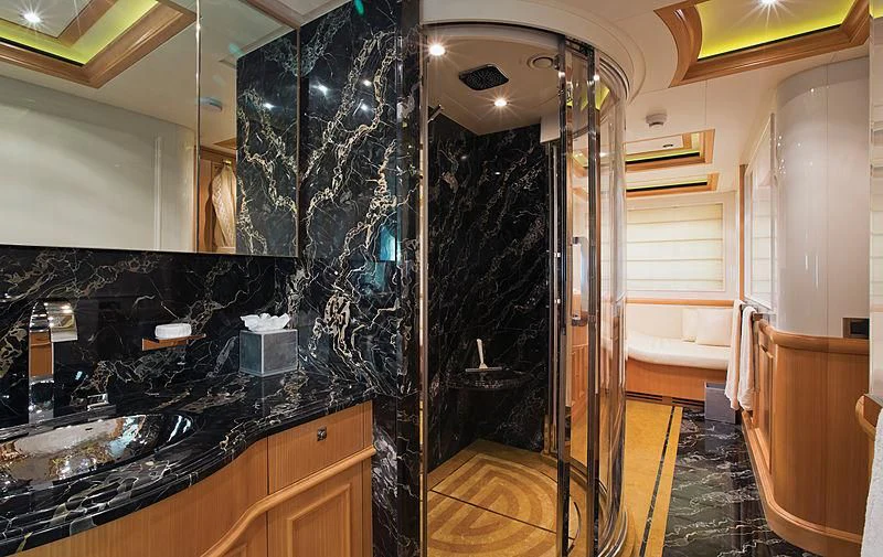 a bathroom with a marble counter top aboard HANA Yacht for Charter