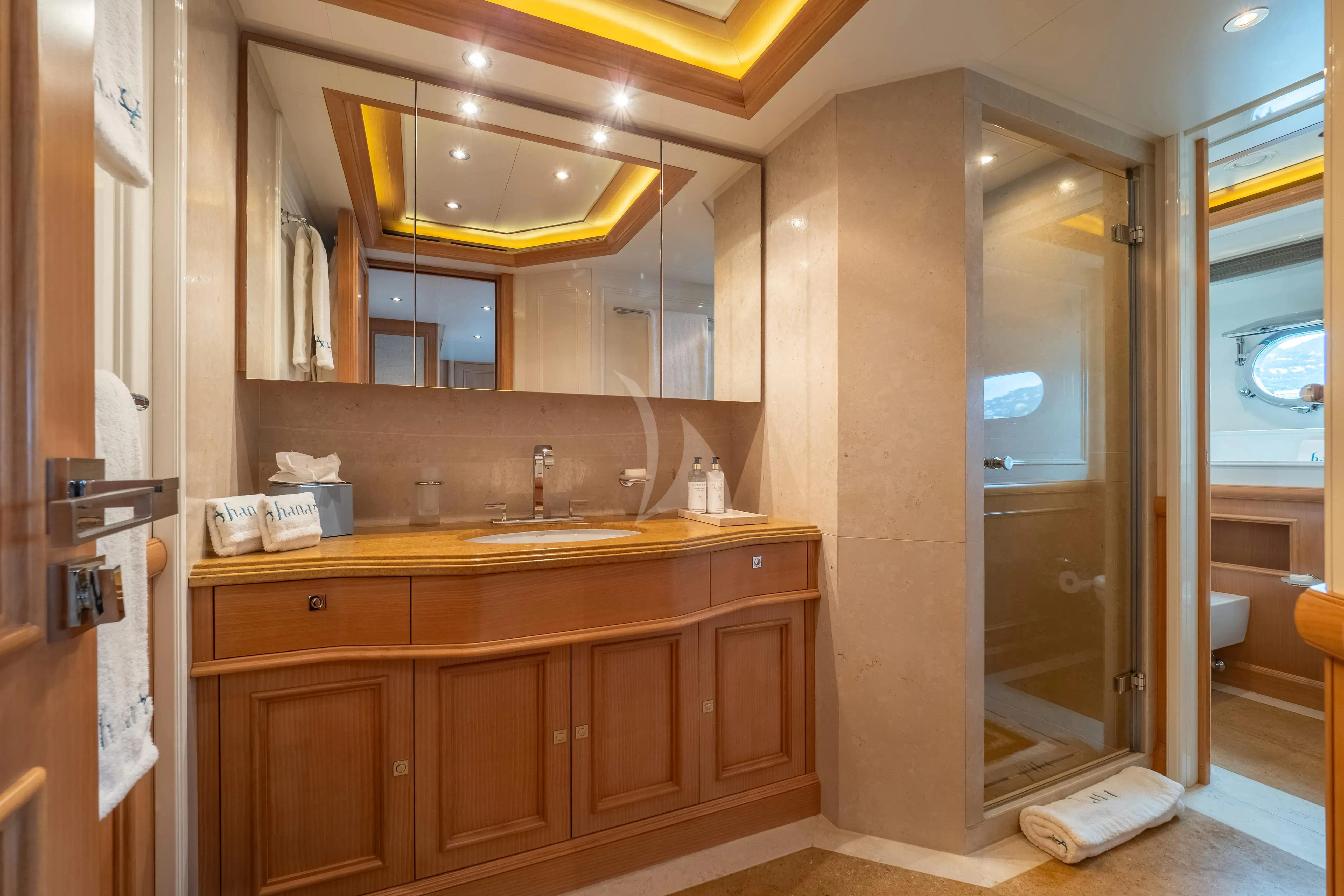 a bathroom with a sink and cabinets aboard HANA Yacht for Charter