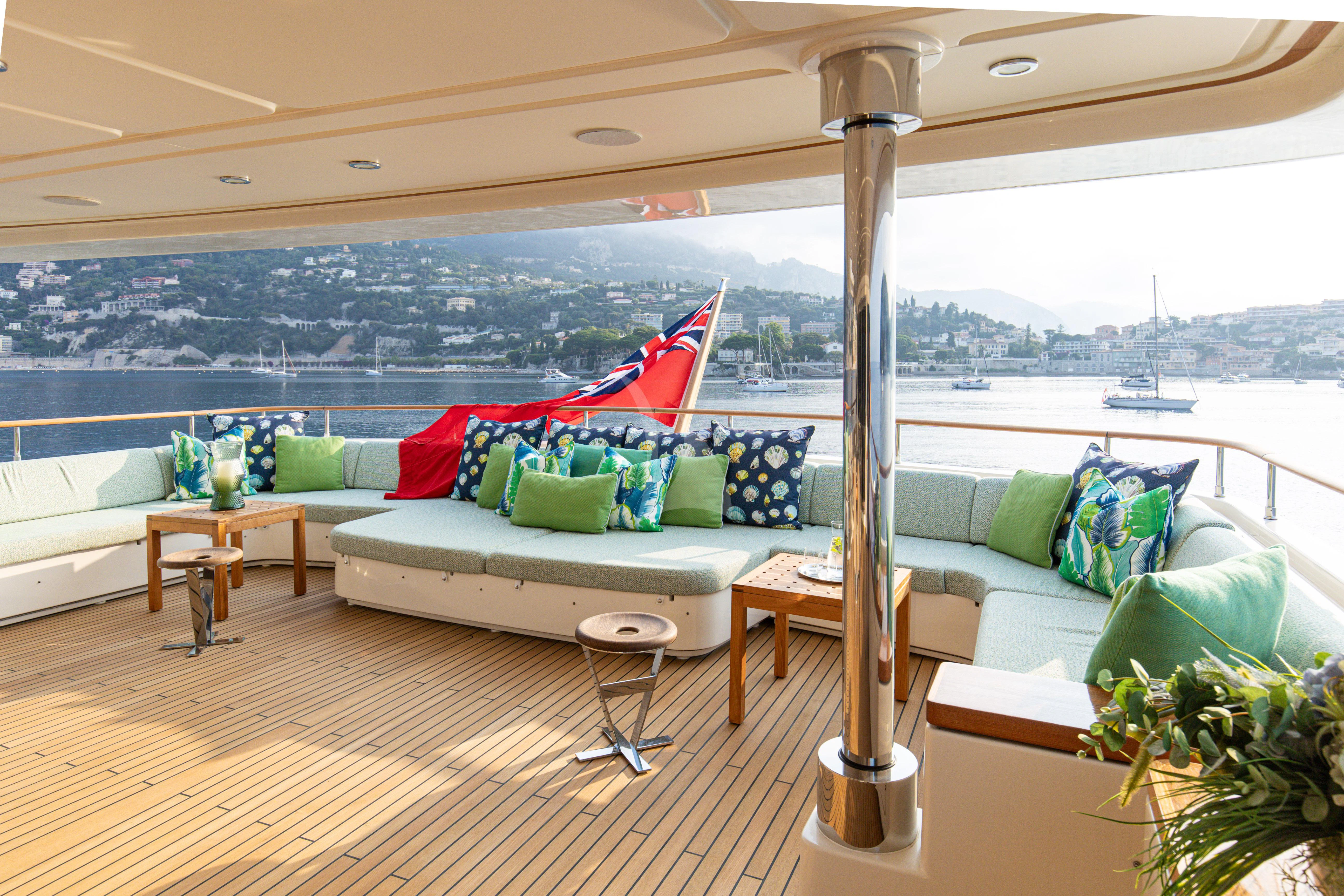 a living room with a large window aboard HANA Yacht for Charter