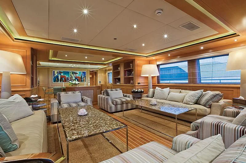 a living room with a large window aboard HANA Yacht for Charter