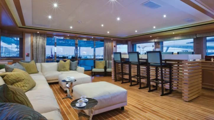 a living room with a couch and a table aboard HANA Yacht for Charter