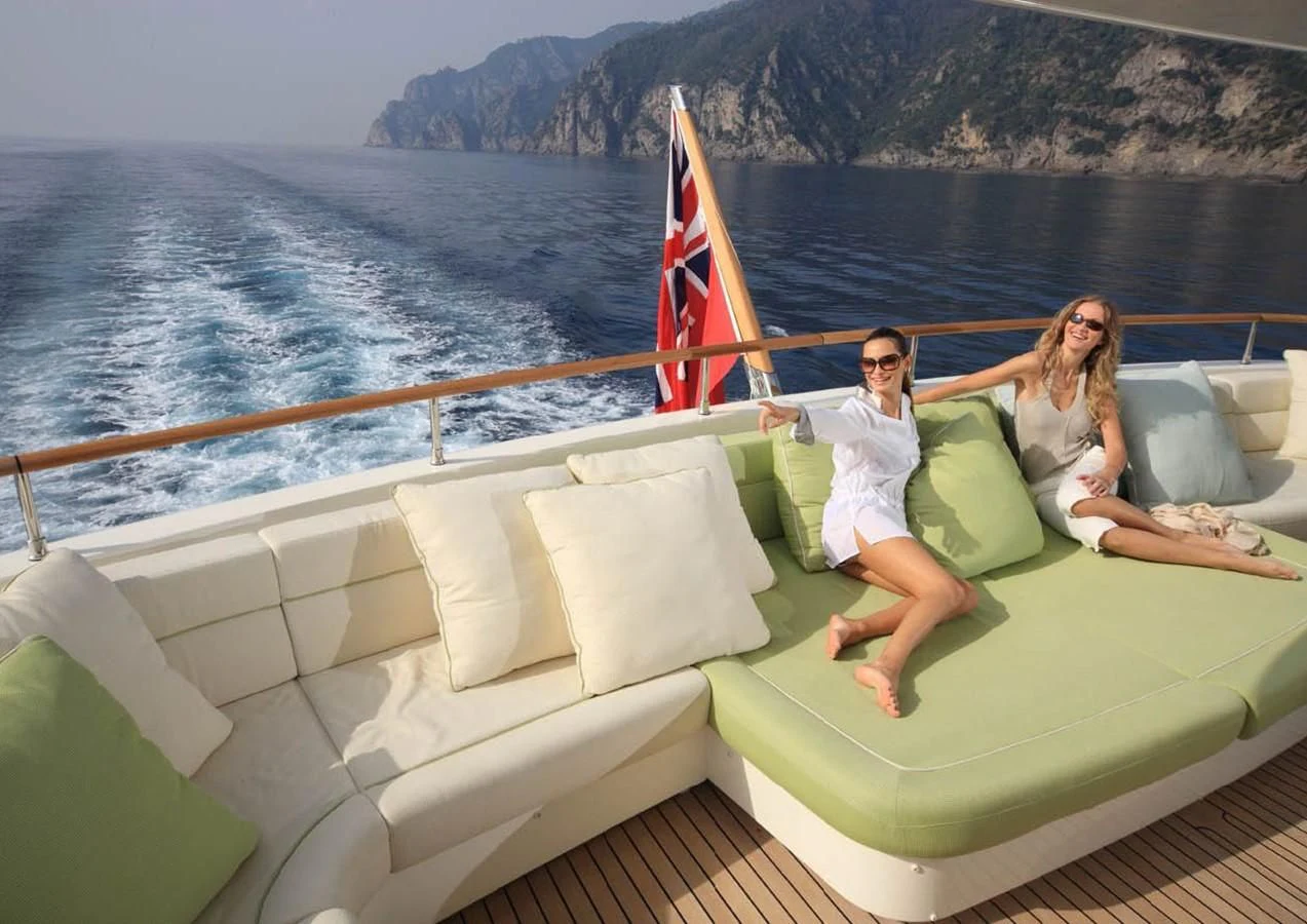 a couple of women on a boat aboard HANA Yacht for Charter