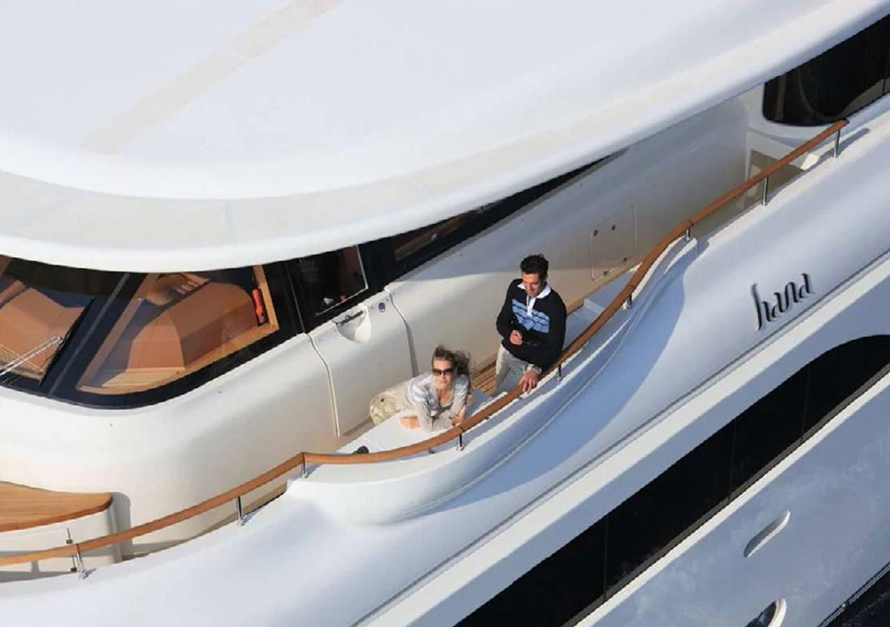a man and a woman on an airplane aboard HANA Yacht for Charter