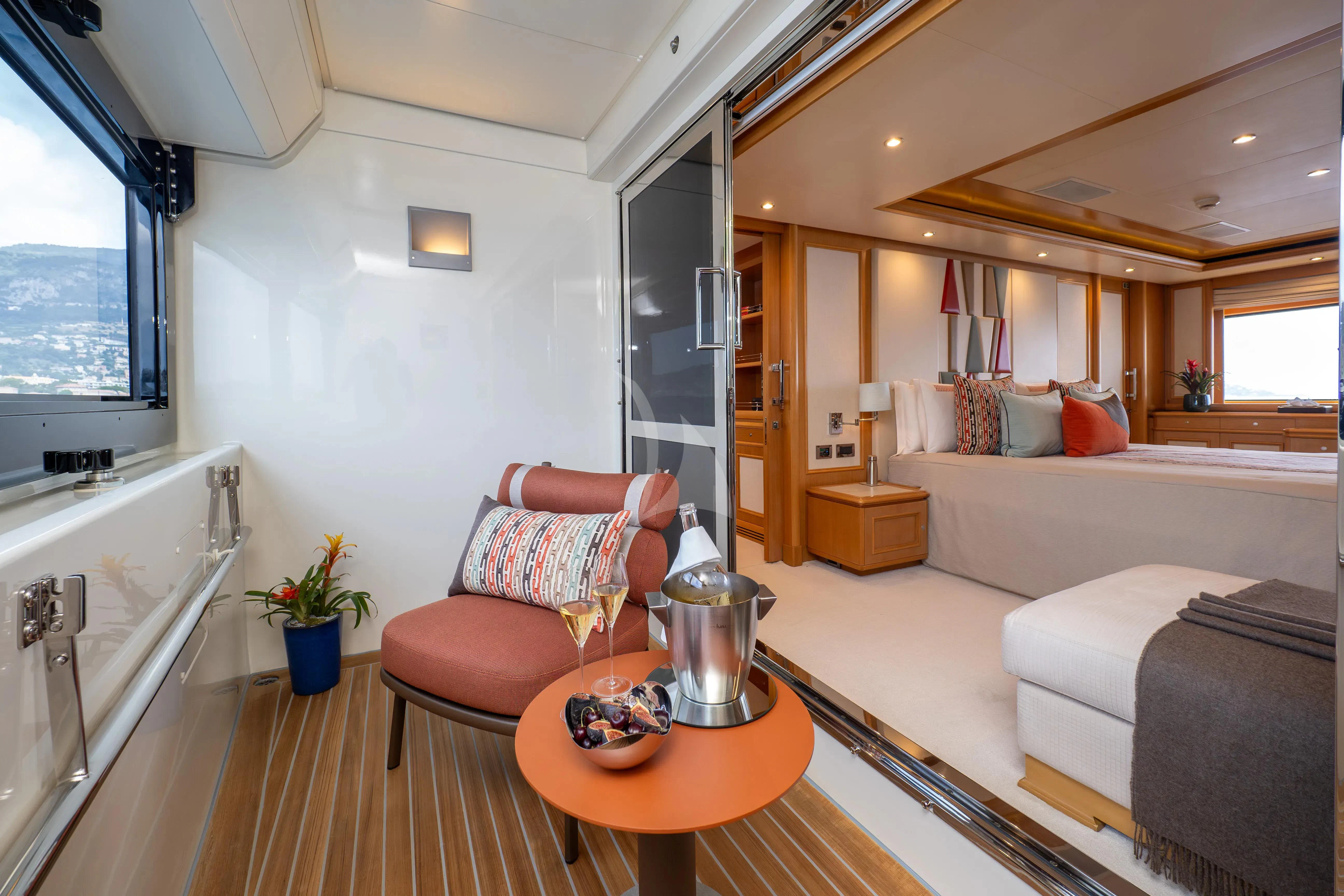 a living room with a tub and couches aboard HANA Yacht for Charter