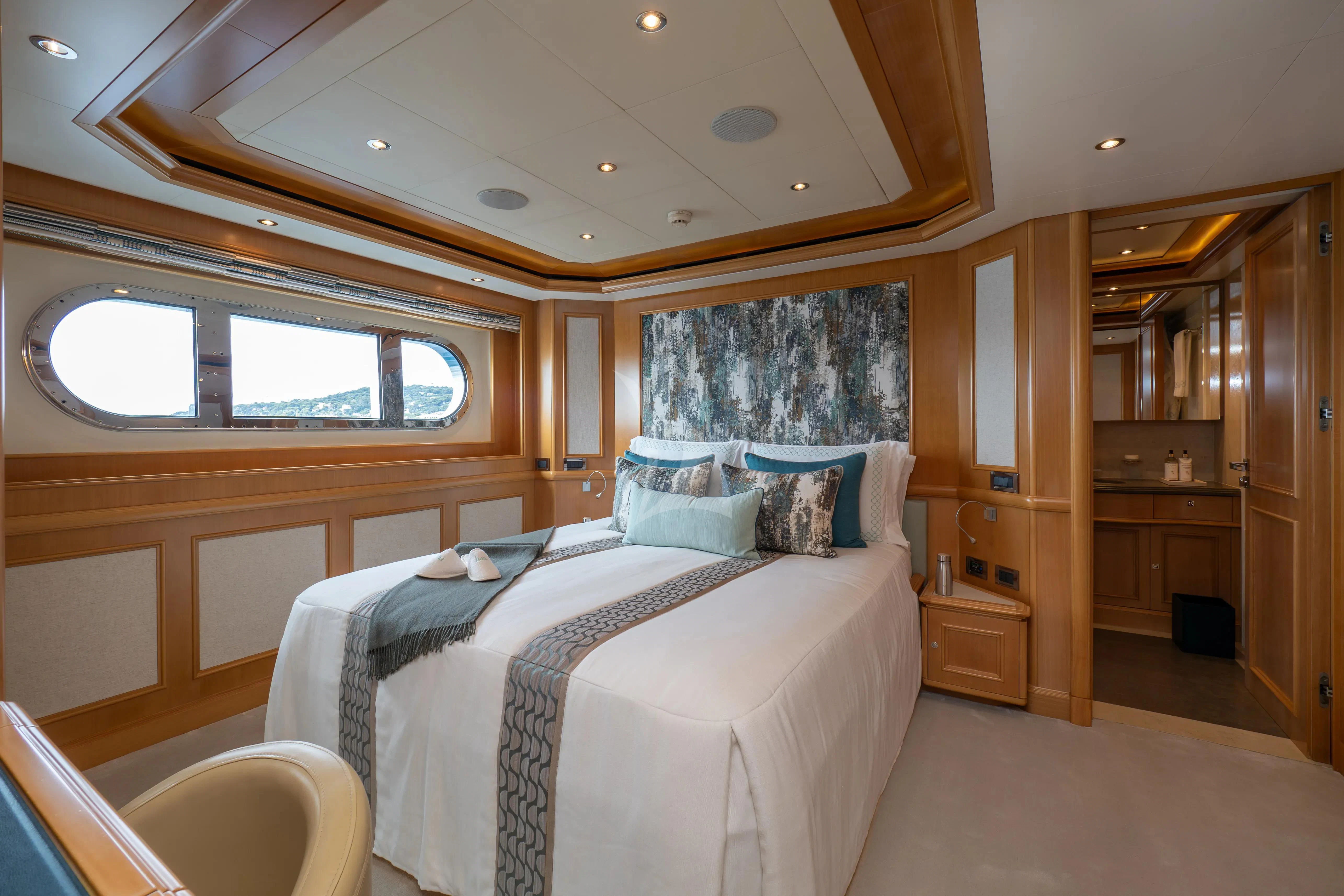 a room with two beds aboard HANA Yacht for Charter