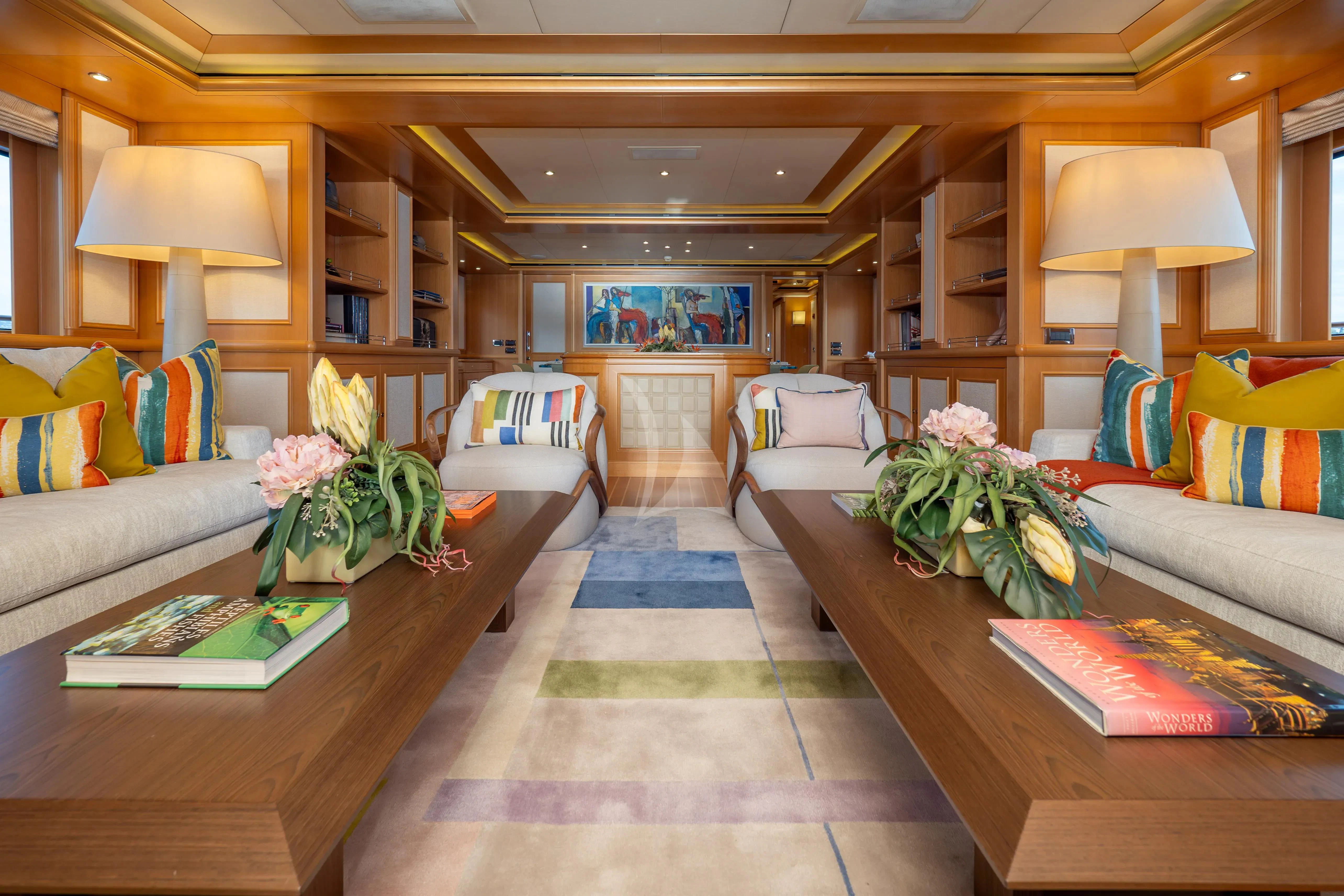 a living room with a large window aboard HANA Yacht for Charter