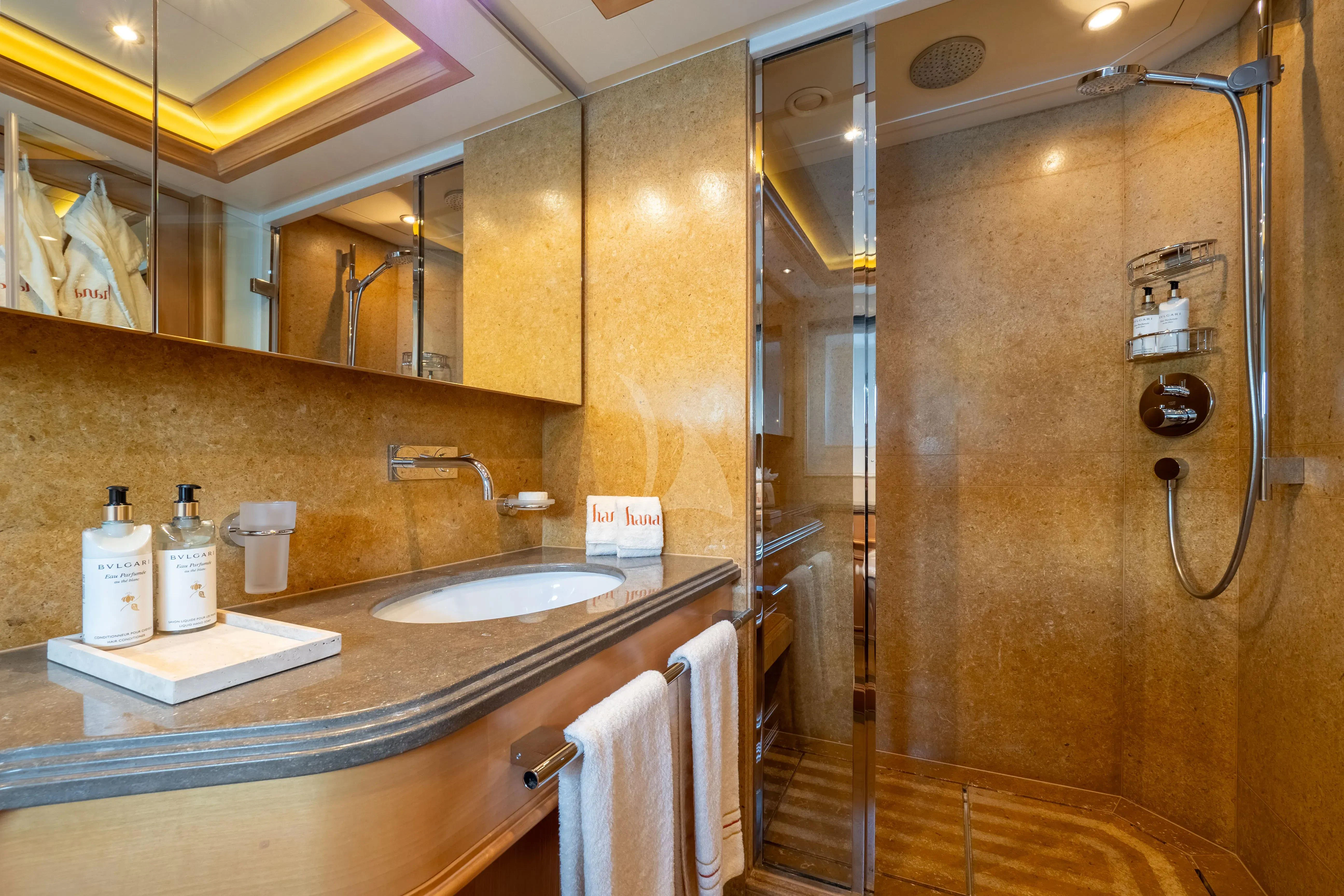 a bathroom with a large shower aboard HANA Yacht for Charter