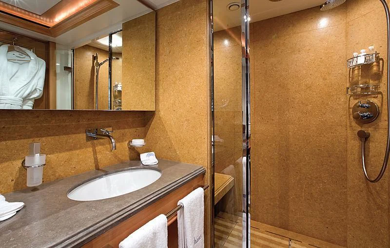a bathroom with a sink and a mirror aboard HANA Yacht for Charter