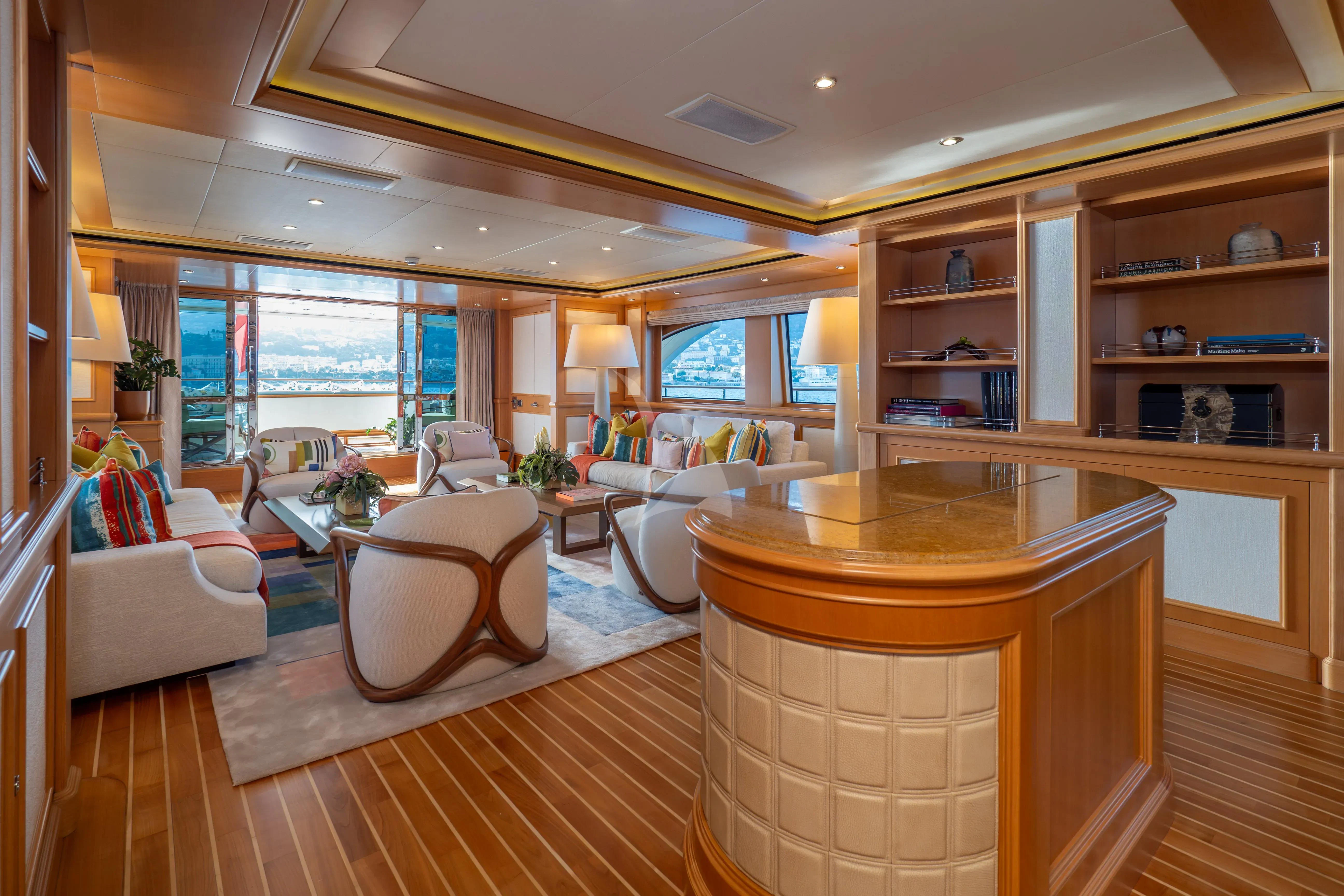 a living room with a table and chairs aboard HANA Yacht for Charter