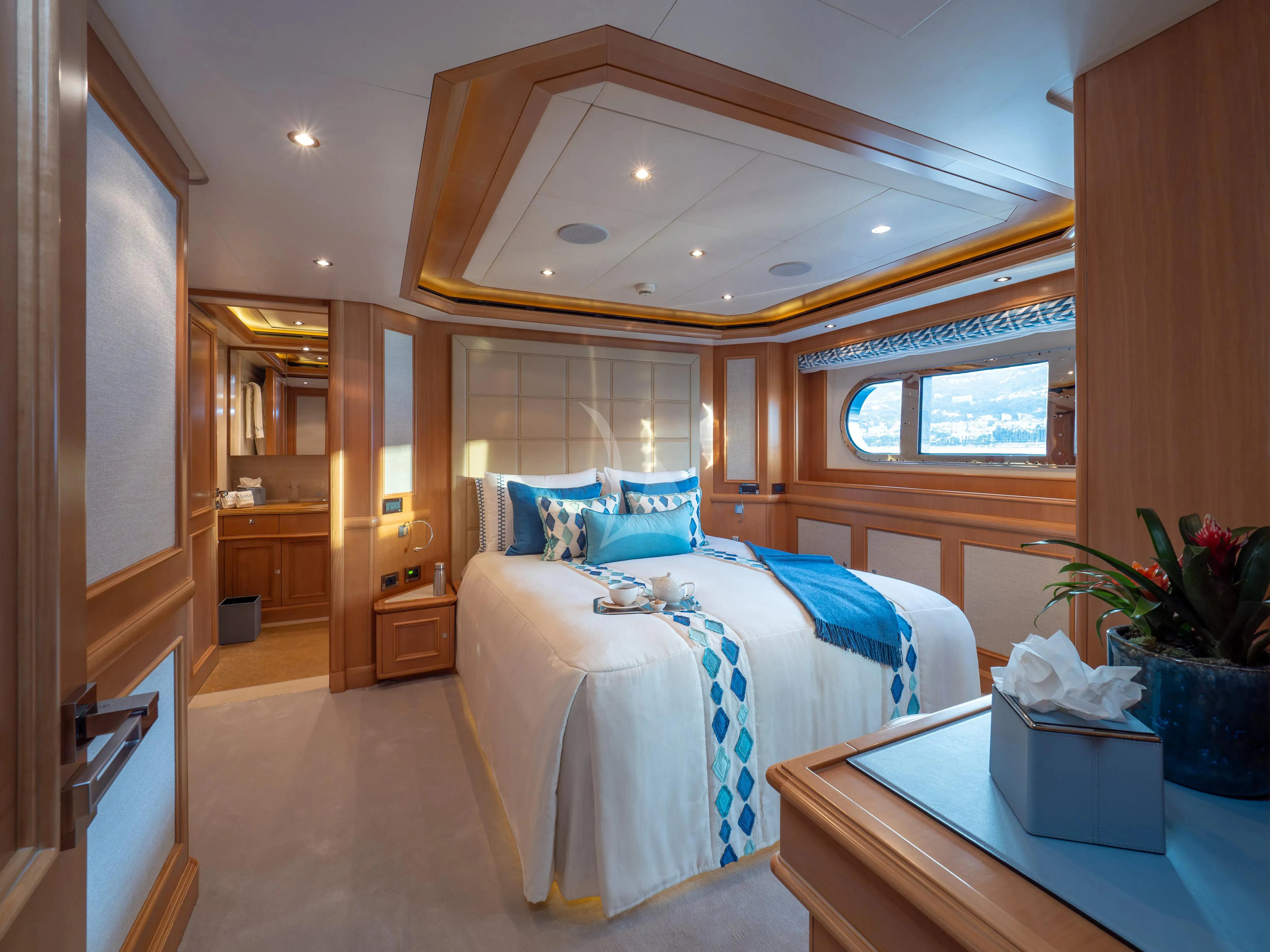 a room with two beds aboard HANA Yacht for Charter