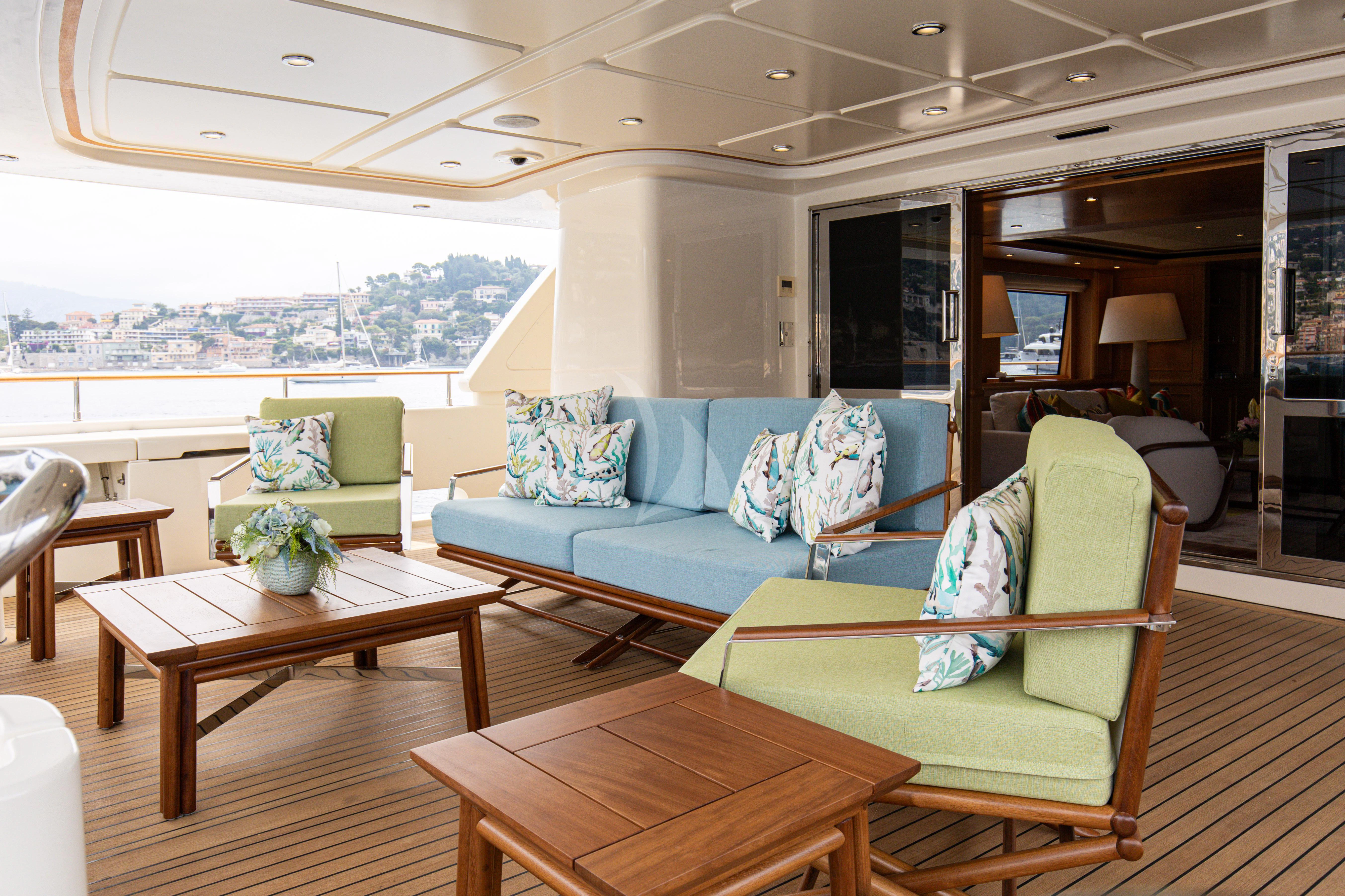 a living room with a couch and a table aboard HANA Yacht for Charter