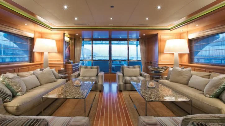 a living room with a large window aboard HANA Yacht for Charter