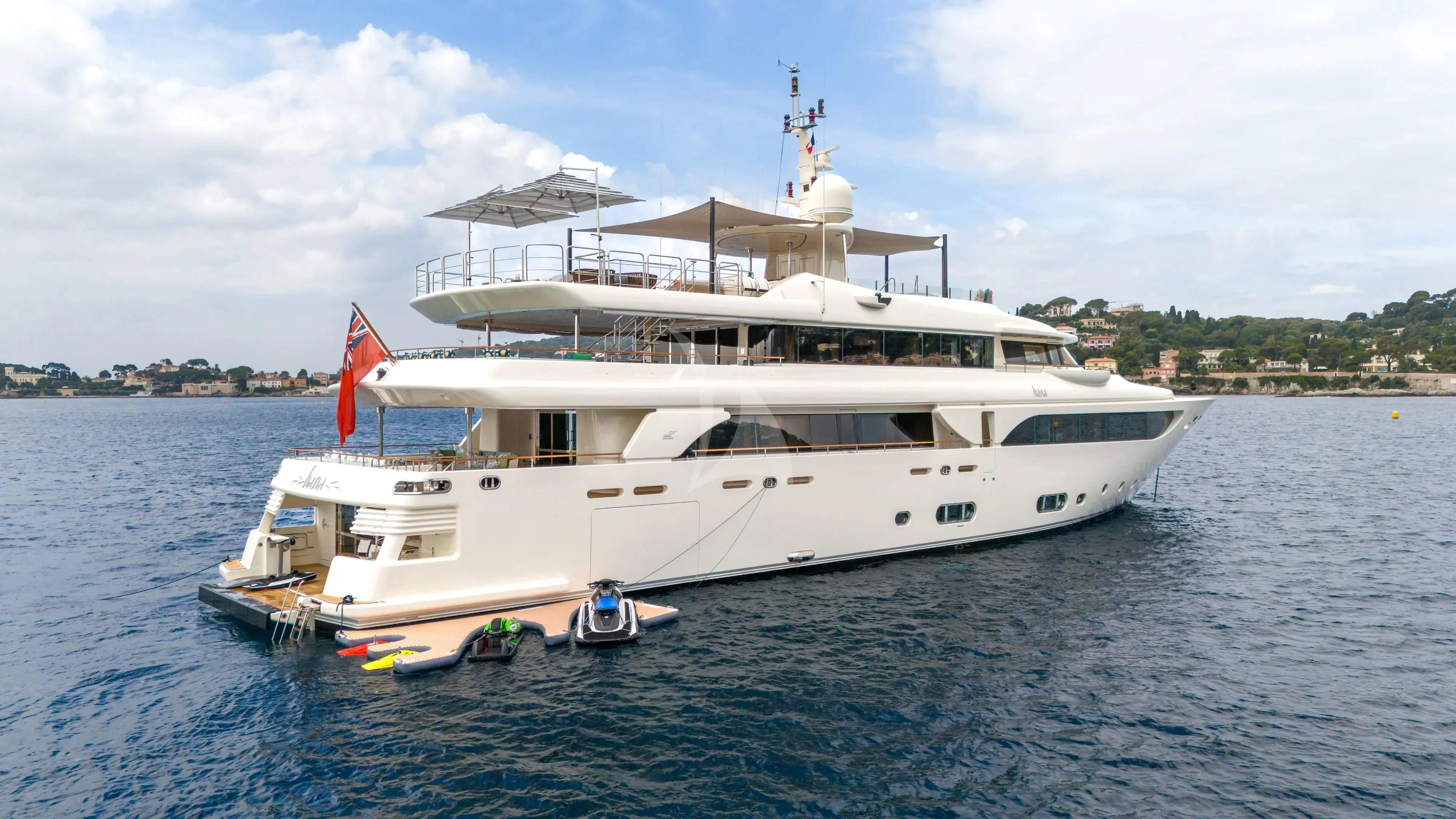a large white boat on the water aboard HANA Yacht for Charter