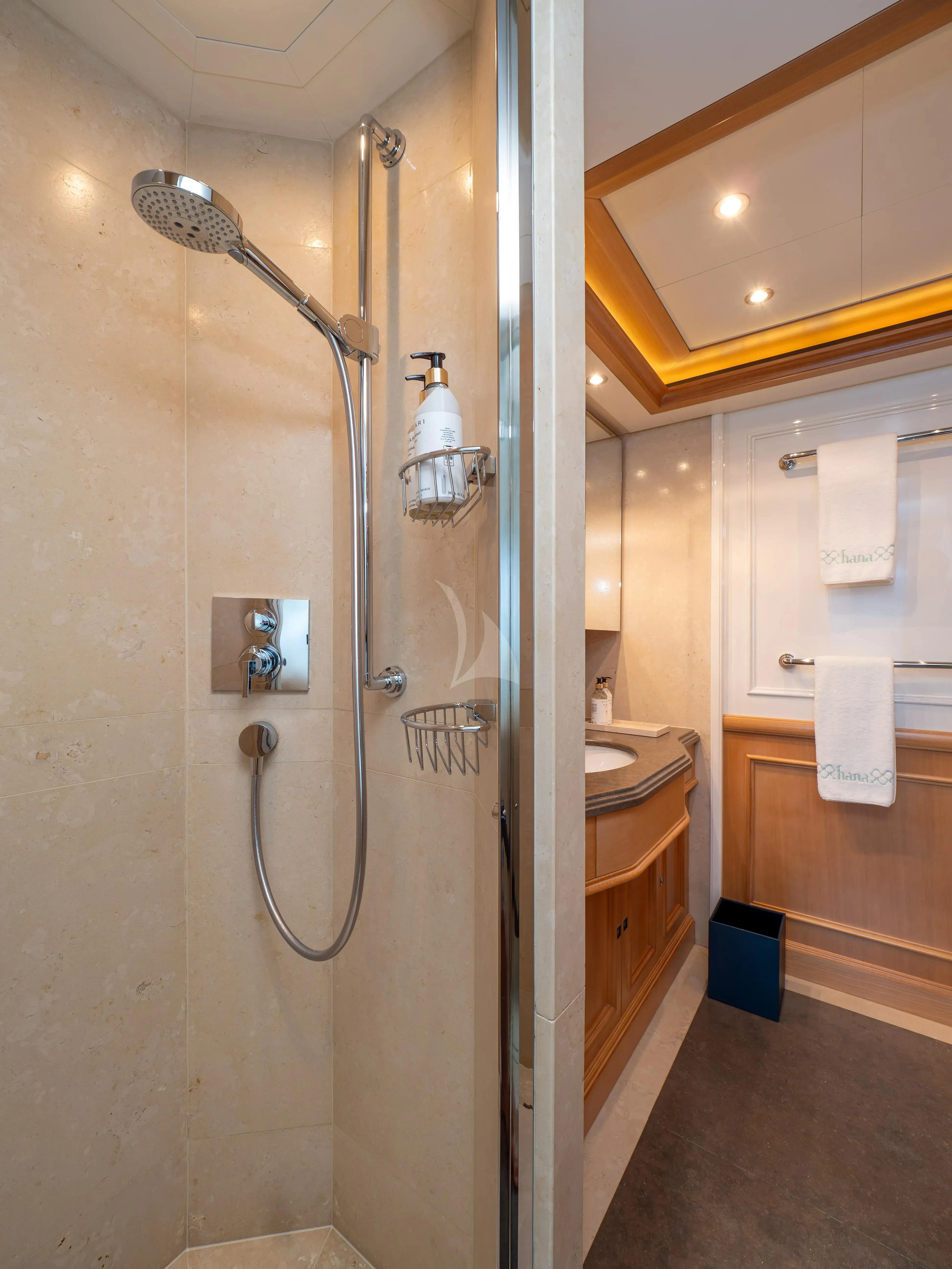 a shower with a glass door aboard HANA Yacht for Charter
