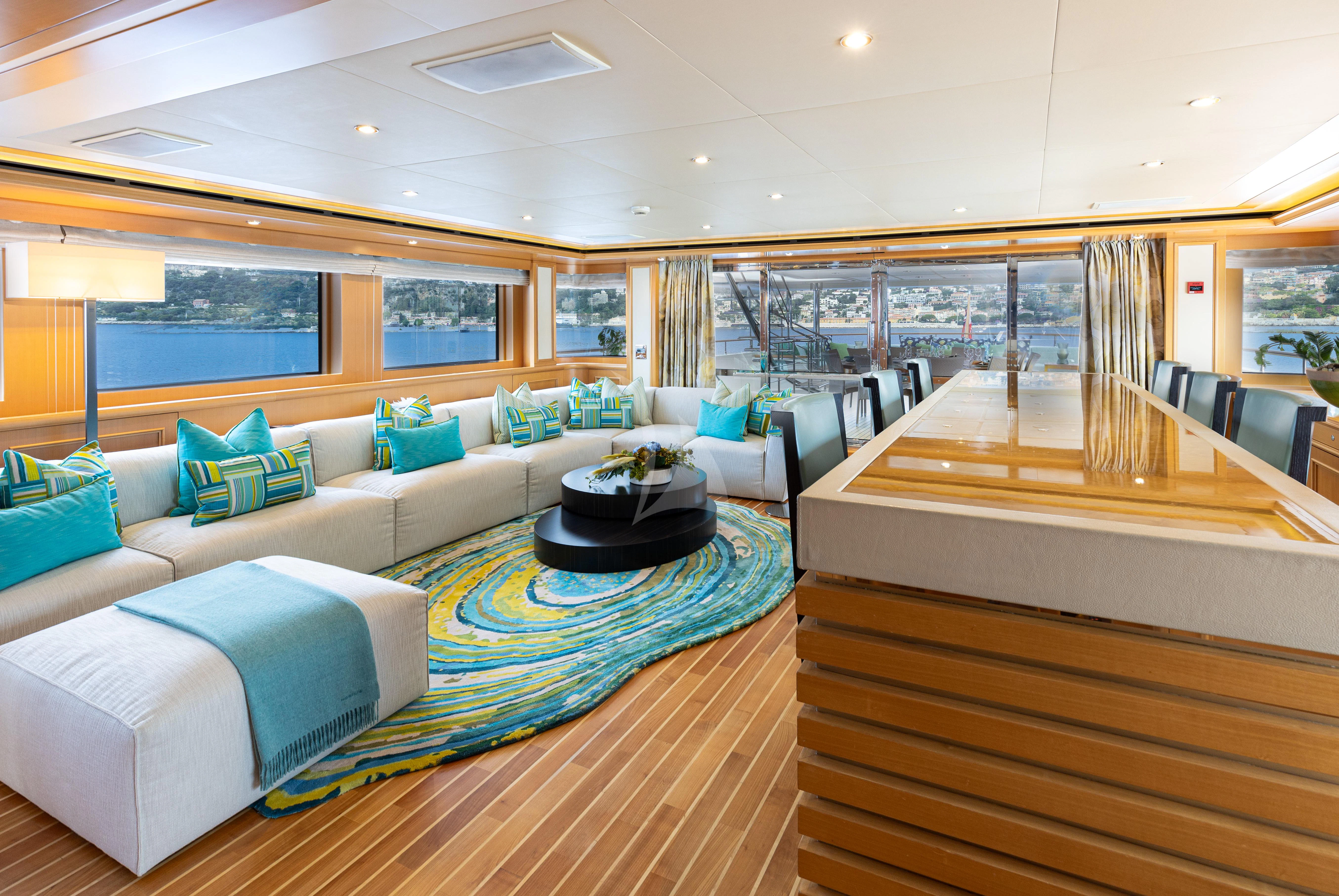 a room with a couch and a table aboard HANA Yacht for Charter