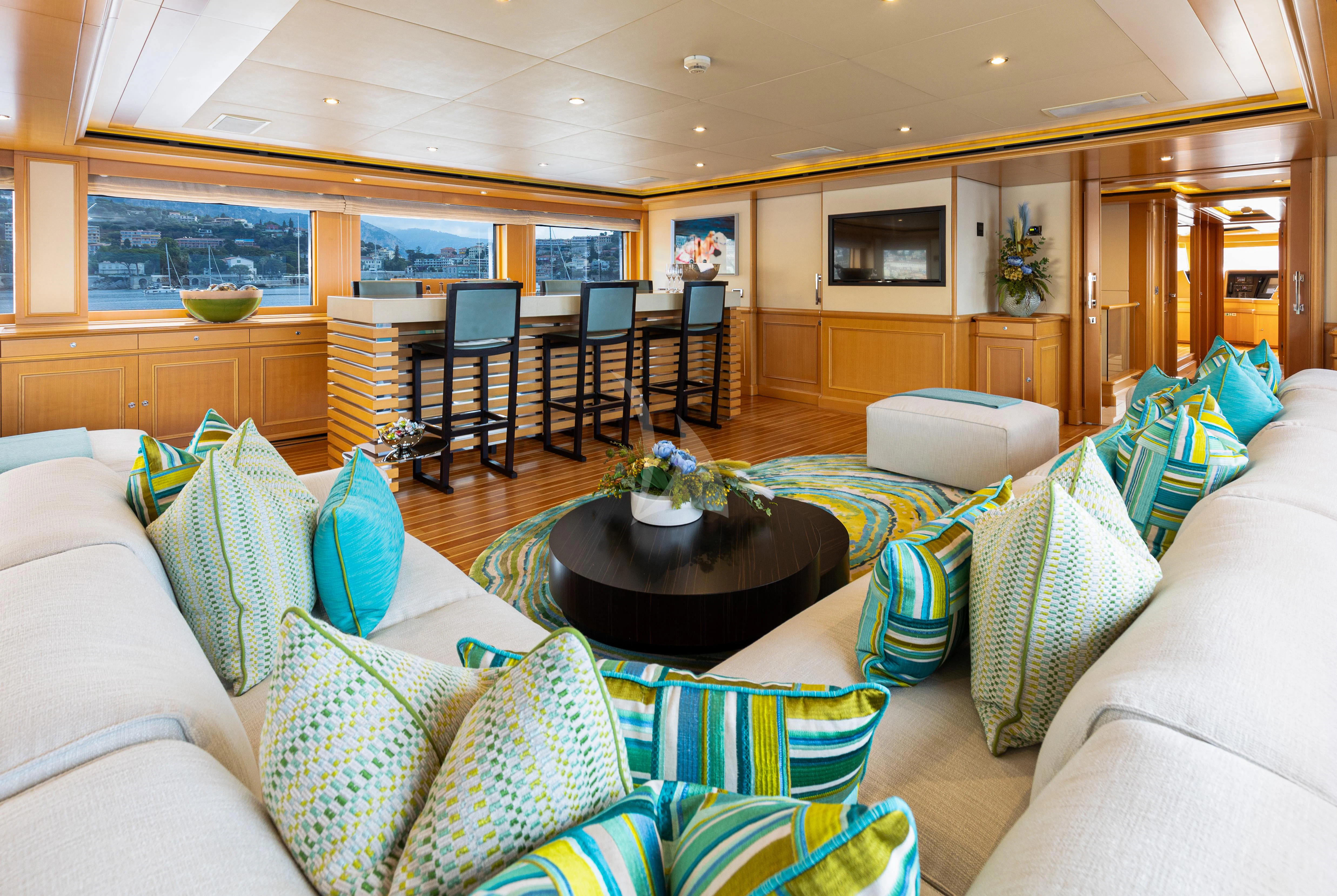 a living room with a large window aboard HANA Yacht for Charter