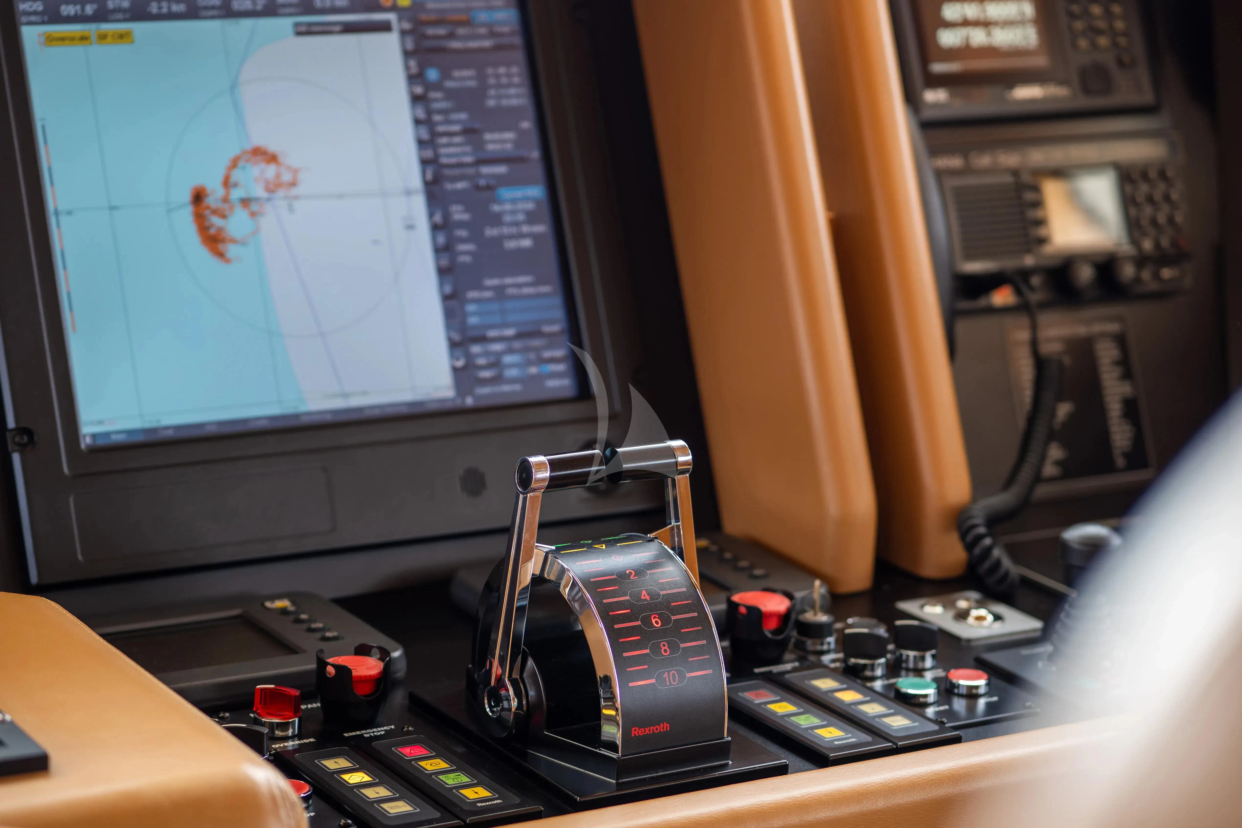 a computer monitor and a camera on a desk aboard HANA Yacht for Charter