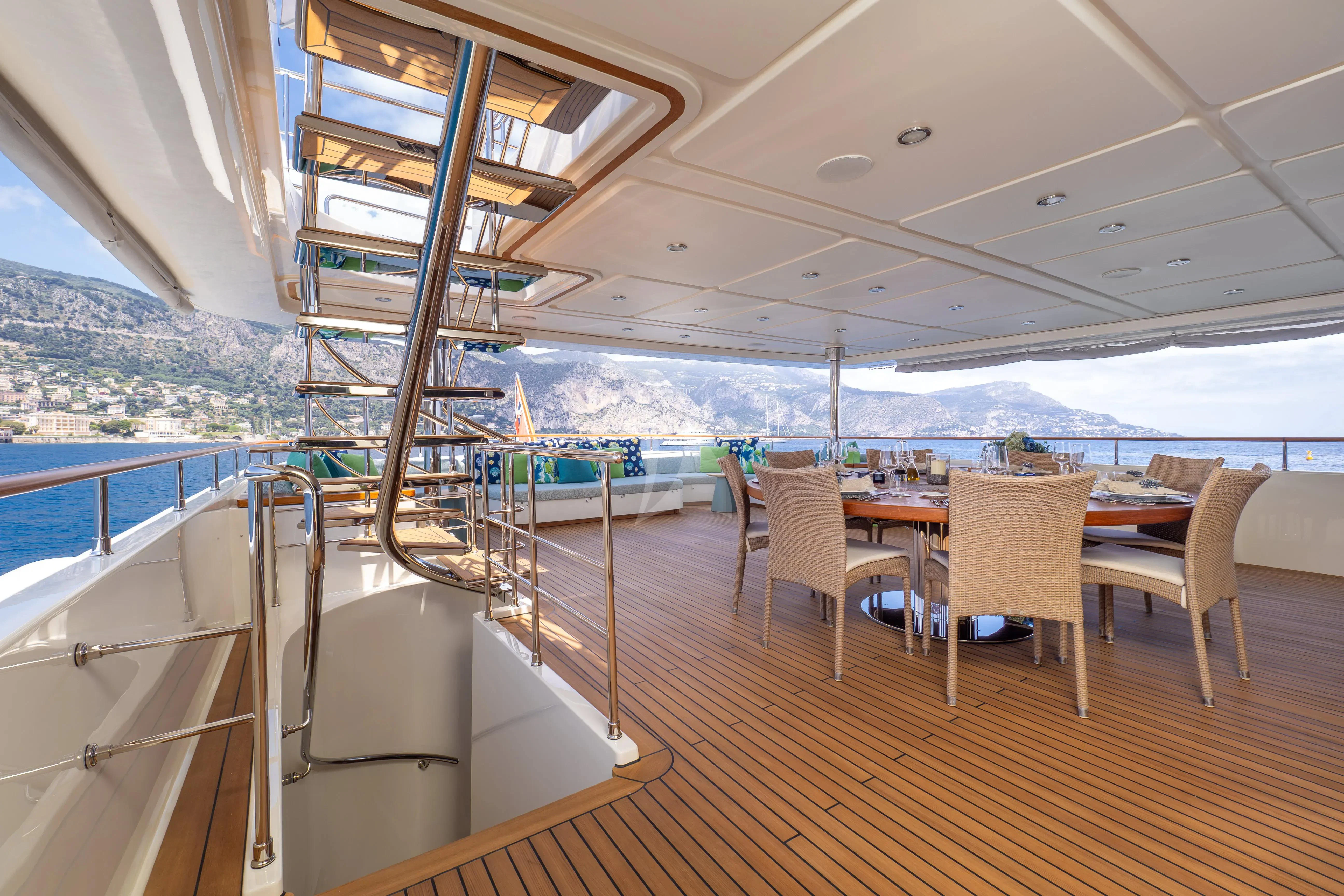 a room with a table and chairs aboard HANA Yacht for Charter