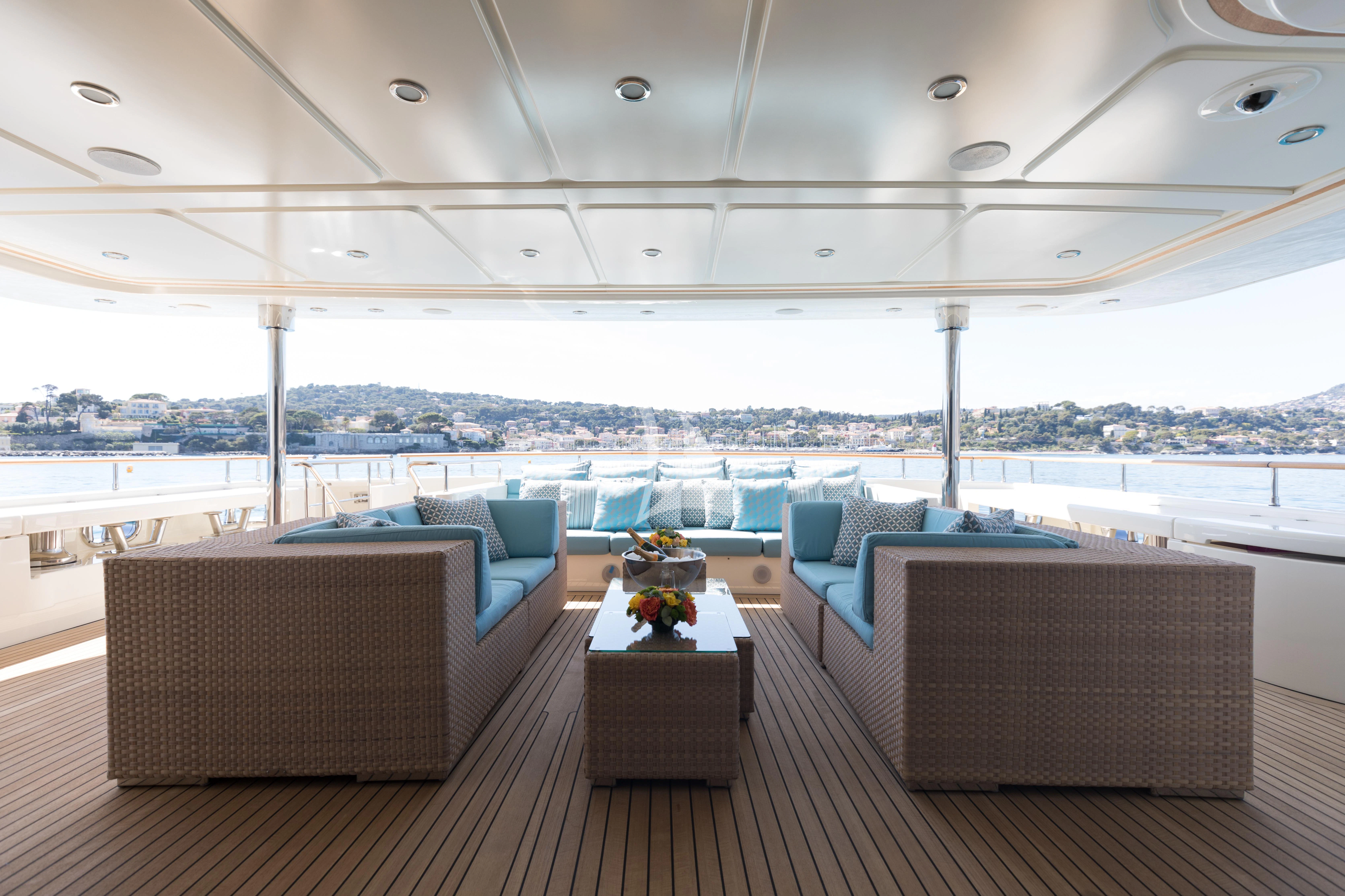 a room with a table and chairs aboard HANA Yacht for Charter