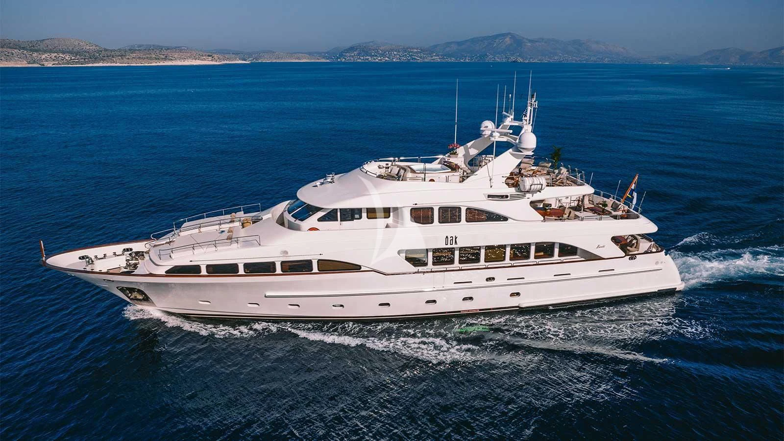 a white yacht in the water aboard OAK Yacht for Charter