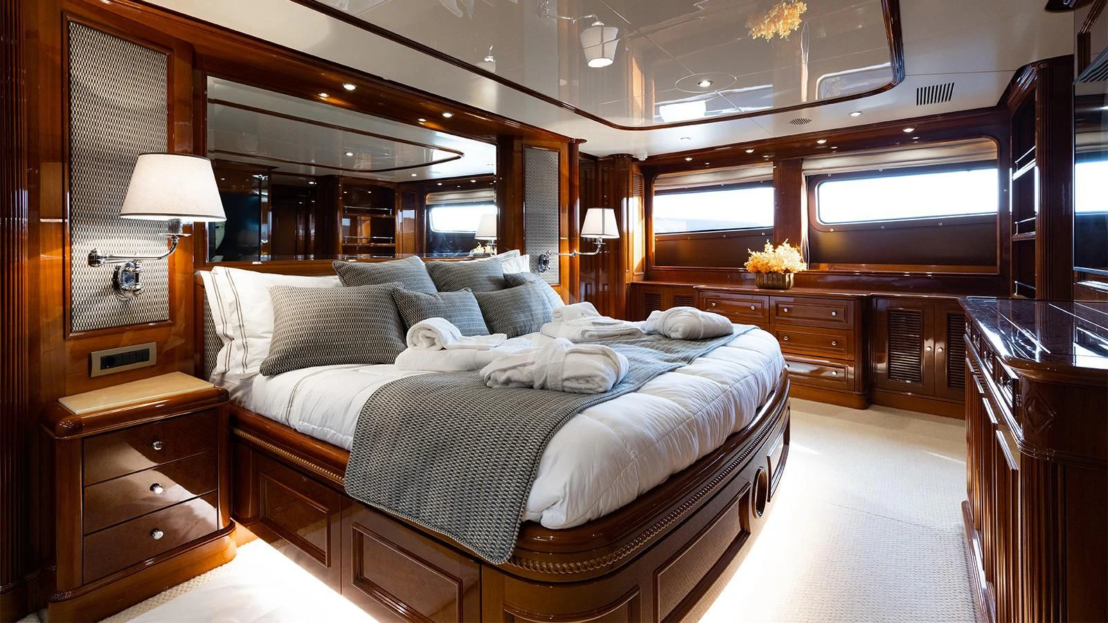 a bedroom with a large bed aboard OAK Yacht for Charter