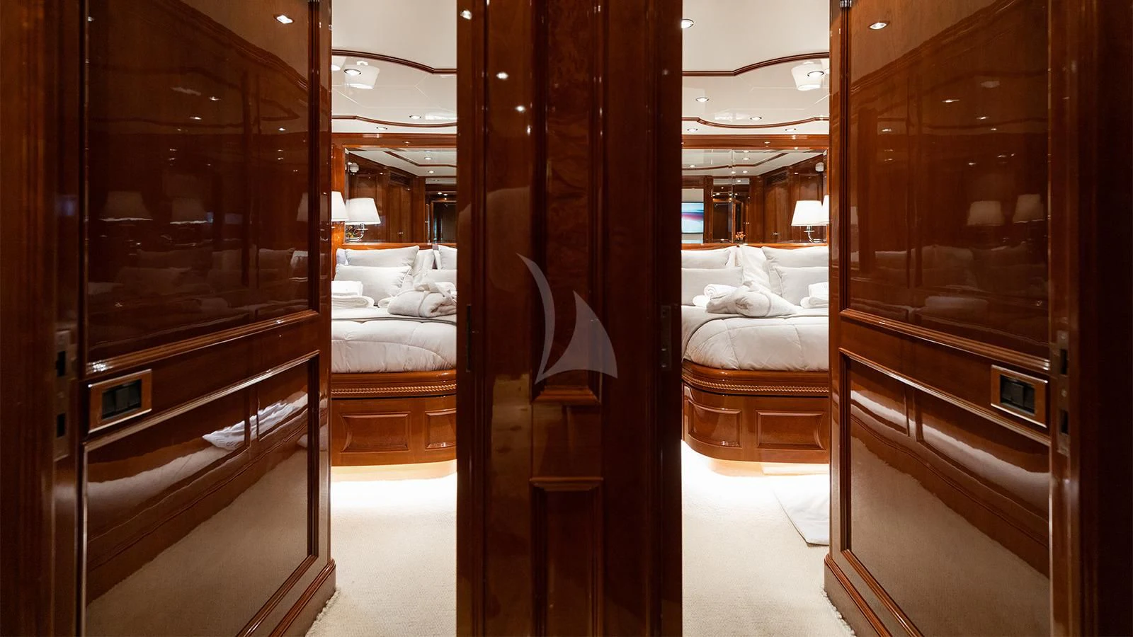 a room with a bed and a closet aboard OAK Yacht for Charter