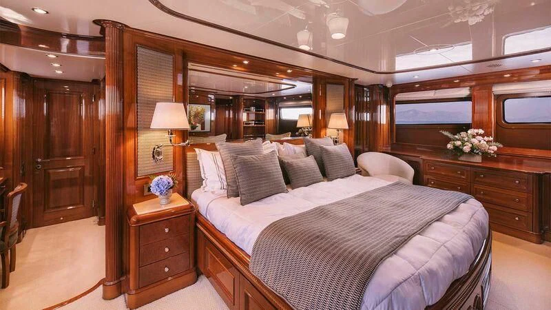 a large bed in a hotel room aboard OAK Yacht for Charter