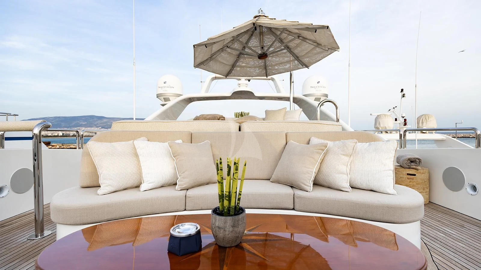 a living room with a large sofa aboard OAK Yacht for Charter