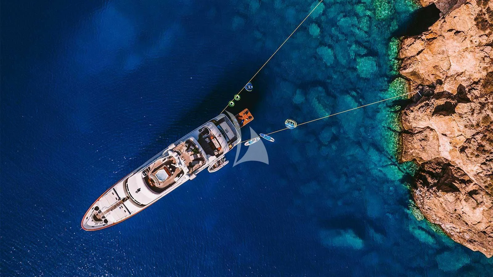 a white and black boat in the water aboard OAK Yacht for Charter
