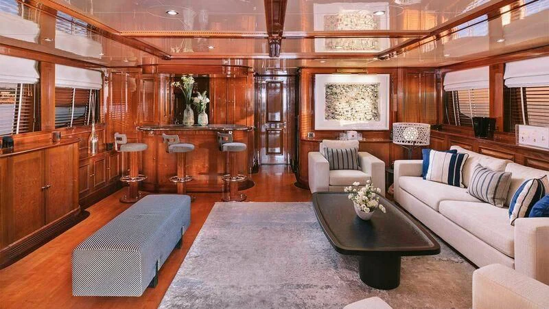 a room with a couch and a table aboard OAK Yacht for Charter