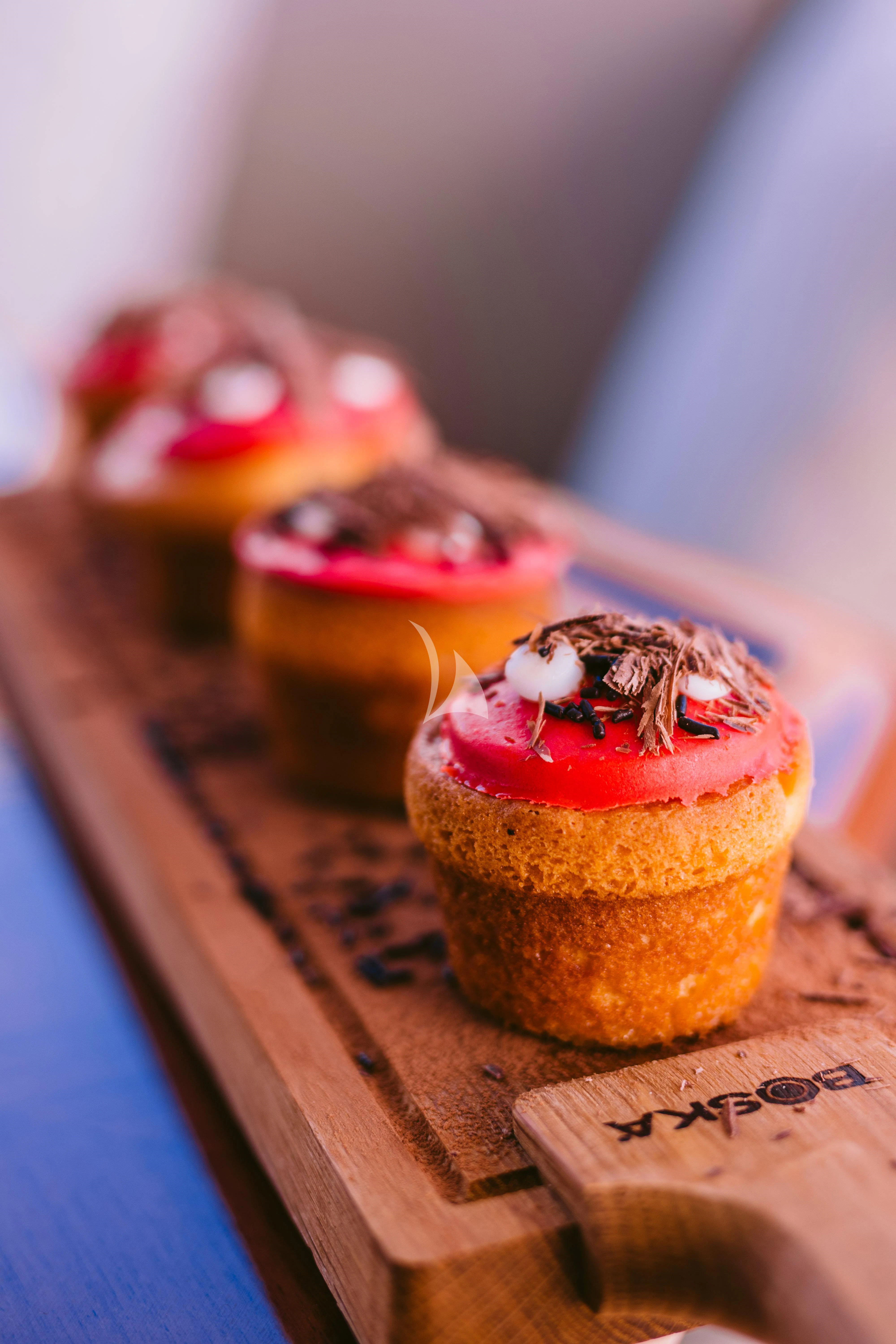 a group of colorful cupcakes aboard OAK Yacht for Charter
