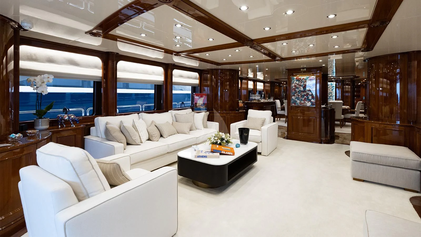 a living room with a large window aboard OAK Yacht for Charter