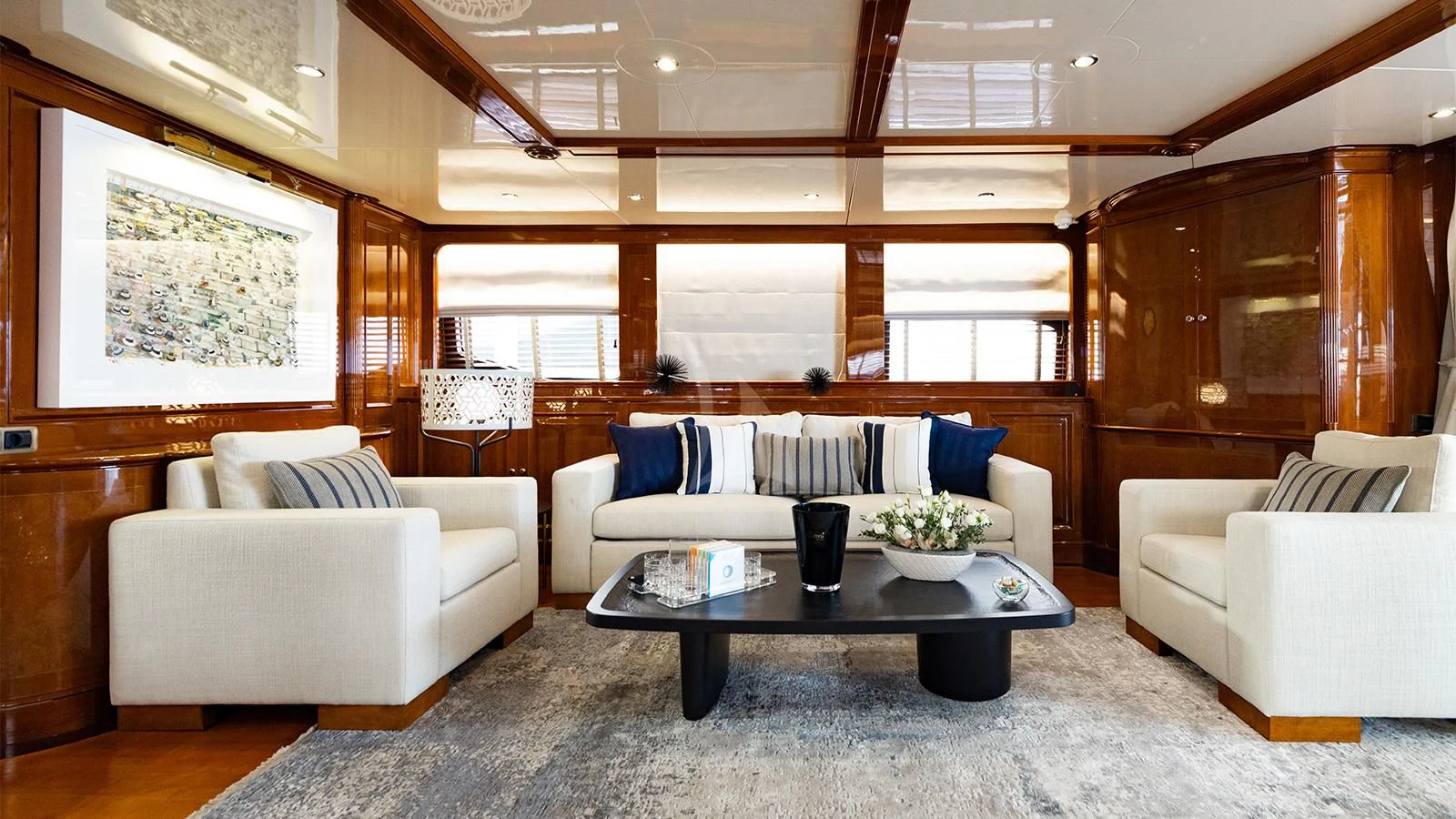 a living room with a couch and a coffee table aboard OAK Yacht for Charter