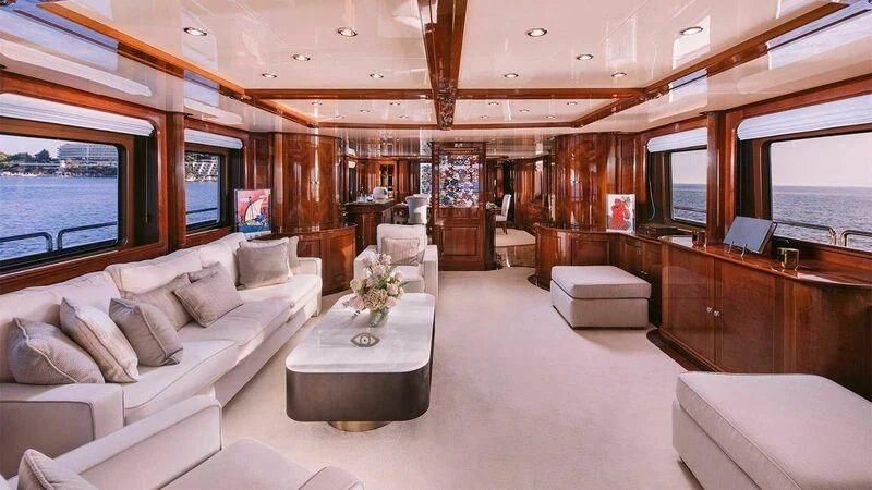 a room with a couch and a table aboard OAK Yacht for Charter